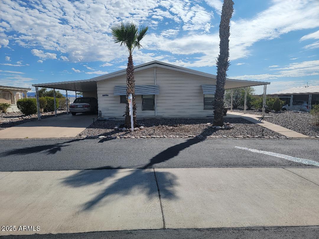 This home is open and spacious feeling. WOW, the VIEWS are beautiful! This 2 bedroom 2 bath furnished home has a beautiful remodeled kitchen with granite counter tops, newer cabinets, stainless appliances. Brand new central Air conditioning!  The home was replumbed with PEX plumbing. The bedrooms are oversized and comfortable. The laundry room has a planning desk area and front loading washer and dryer. A large patio area to enjoy this quiet street and the views. Large patio doors out the back to enjoy the sunrise vies as well. This home is a must see!