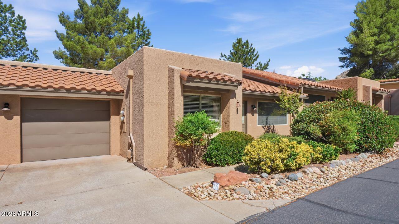 Welcome to this casita-style Morning Sun condo, offered under $500,000 in the heart of west Sedona! This bright and airy 2-bedroom, 2-bath home offers 1,239 sq ft of comfortable living space with vaulted ceilings, abundant natural light, & skylights equipped with shades.
The spacious floor plan creates an inviting interior feel with plenty of potential to personalize.  It is perfect for buyers ready to add a little elbow grease and TLC to make it their own. With a fair offer, Seller will give-at closing-an $8,000 credit toward new flooring.  Ideally located close to amenities including restaurants, theaters, gyms, grocery stores, and some of the area's best hiking and biking trails, this property combines convenience, charm, and opportunity in one desirable package. Rental min. is 4 month