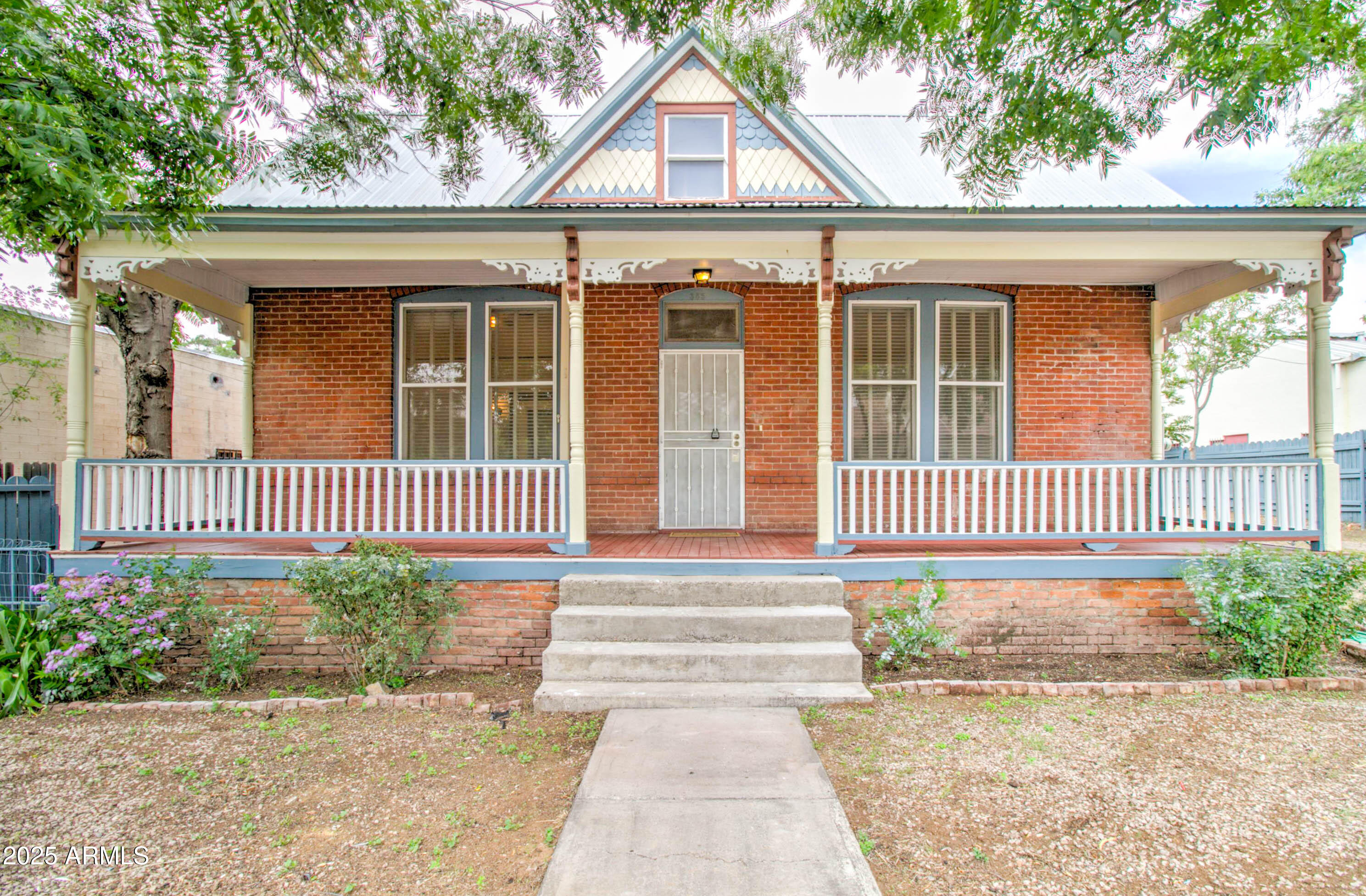 **ASSUMABLE LOAN**This 1900s Craftsman home, once the AZ Eastern Railroad manager's residence, boasts captivating red brick architecture. A historical gem, it retains original millwork, built-ins, and 12-foot ceilings. Situated on Historic Downtown Globe's Broad Street, it's an ideal base to explore. Updated with central heating, new flooring, window blinds, a stove/oven, and fresh paint, the home offers 3 bedrooms, 1.5 baths, and a claw foot tub. Immerse in history on the inviting porch, or enjoy the fenced backyard. This property blends Arizona's heritage with modern living. It's the perfect place to stay while visiting Globe and/or the surrounding areas. This property is designated under the C3 category, allowing for many uses (Residential and/or Commercial)