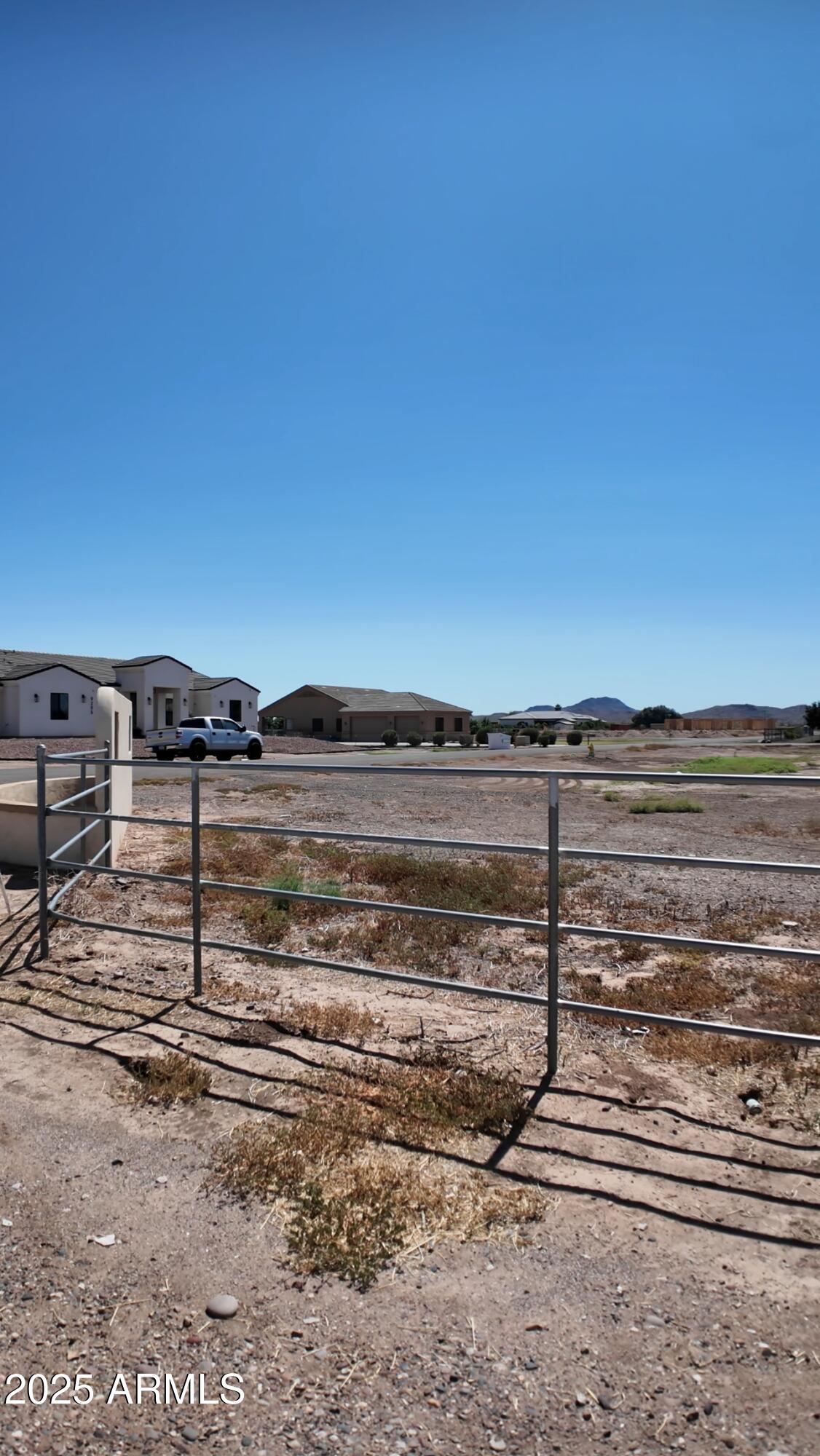 Rare 1-acre cul-de-sac corner lot in White Fence Farms! This prime parcel offers no building restrictions, paved city roads, Irrigation rights, and power and light near the lot line. Surrounded by million-dollar custom homes, it boasts breathtaking mountain views and ideal north-south exposure--perfect for building your dream property. Property is half fenced and horses are allowed ..