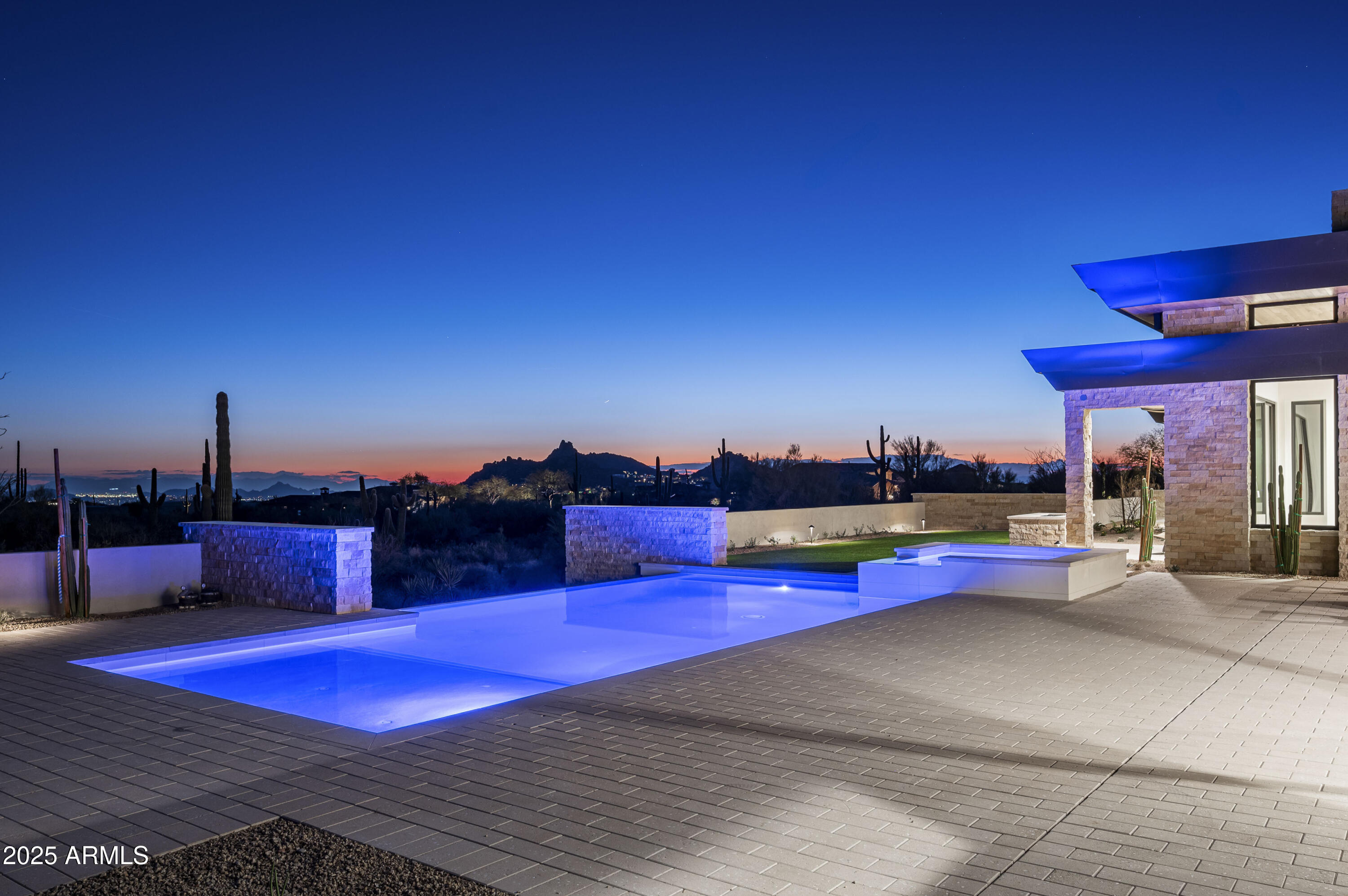 Completed January 2025.  Introducing this breathtaking, newly constructed estate located in the desirable Goldie Brown Ranch in North Scottsdale, just moments from the Four Seasons Resort and renowned Scottsdale National Golf Club. Designed by the acclaimed Swaback Architects and built by Sonora West Development, this sophisticated and contemporary single-level home embodies the pinnacle of modern luxury.
Offering an expansive 5-bedroom, 6.5-bathroom layout, plus an office and private guest casita, this home offers the perfect blend of elegance and functionality. The open-concept great room serves as the heart of the home, seamlessly connecting to the gourmet kitchen and dining spaces. With meticulous attention to detail, every room is designed to take full advantage of the extraordinary surroundings.
Set on nearly 5 acres of pristine desert land, this estate provides unobstructed, panoramic 360-degree views of iconic landmarks, including Tom's Thumb, the McDowell Mountain Preserve, Pinnacle Peak, and Four Peaks. Whether you're enjoying vibrant sunsets or the sparkling city lights below, this home offers unparalleled vistas that create a serene, private retreat.
Additional highlights include a large 4-car garage and a spacious guest casita, perfect for hosting family and friends in luxury and style. Experience the ultimate in Arizona living with this exceptional property where every detail reflects sophisticated craftsmanship and a commitment to refined, modern living.  Furnishings available via separate bill of sale.