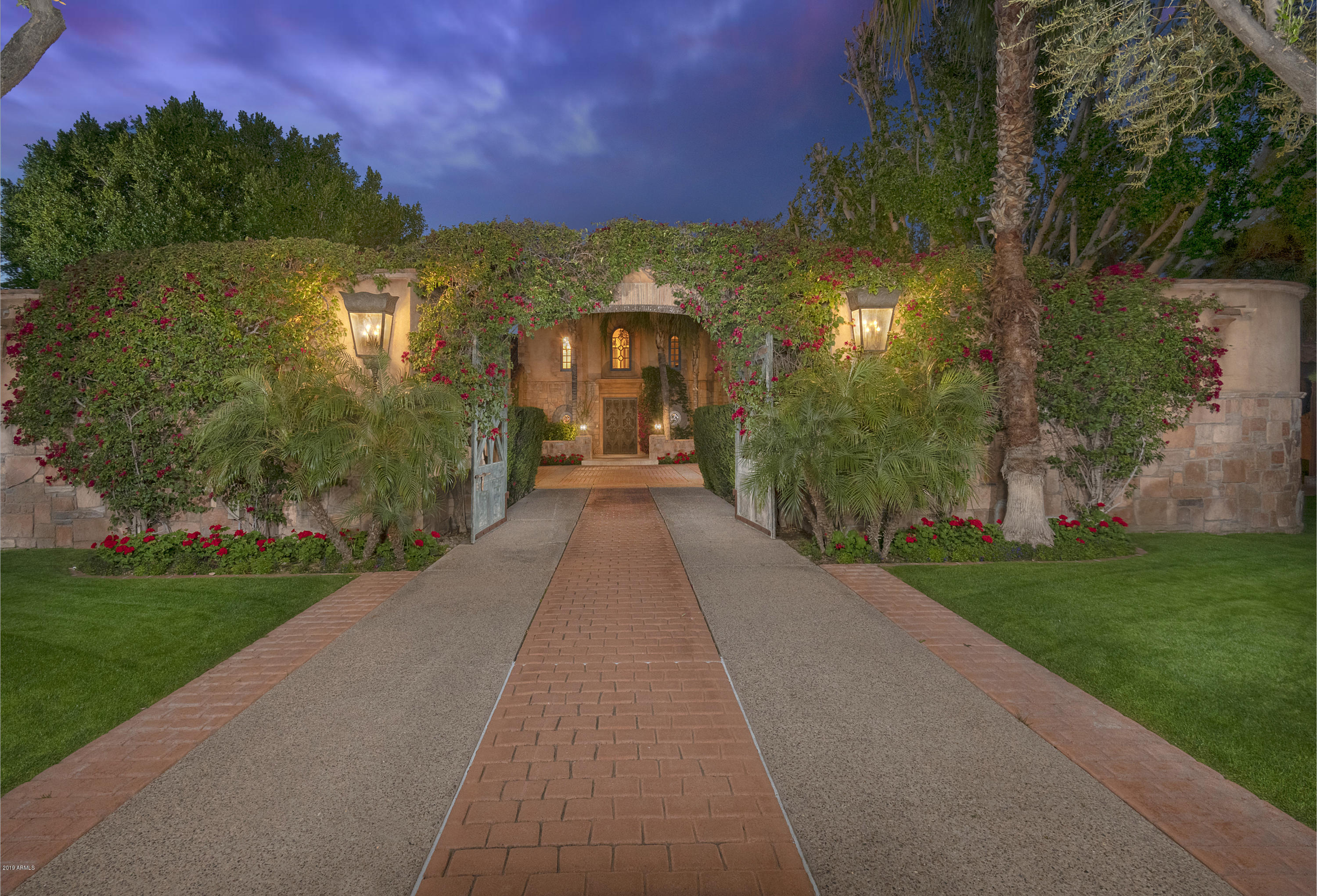 Welcome home to this luxurious estate on the famed Biltmore Circle and Golf Course. Offering secluded privacy, the tree lined drive leads you down the immaculate grounds offering lush, mature landscaping and incredible mountain views. Generously renovated in 2012, the interiors consist of only the finest in materials and craftsmanship. Spectacular wood-beamed ceilings fashioned after the Arizona Inn brings unique character. Beautiful walnut wood floors combine with tumbled travertine set a beautiful tone. Inviting family room filled with french doors & book shelves overlook mature landscaping, pool & spa. Stunning state of the art, light filled, chefs kitchen! Stunning fireplaces & formal dining room. See MOTION VIDEO. Plenty of room for the baby grand! Large master suite w/sitting room upstairs w/it's own bird nest patio & stunning bath area. This very special residence offers considerable charm and class.

Improvements (virtually all in 2011)Concrete Pavered entry drive off of Biltmore Circle; New landscape sprinkler system, Hand carved interior doors from Mexico, Entire roof structure in living room, Wood beamed ceiling in living room and family room, New cantera stone fireplaces in LR and FR, Black Walnut flooring on main level, Remodeled Powder Room off LR, Built out bar area off LR and FR, New Venitian Plaster on main level, Surround Sound system throughout house and exterior; 2 new AC units; Rebuilt Laundry Room; Remodeled Master Bathroom.