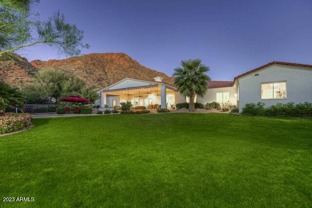Comfortable Arcadia Living on an acre lot, at the base of Camelback, views to the north. Last renovation by Architect David Dick to include 5 en suites, oversized office, private gym, huge family room, entertainers kitchen with 2 wine coolers and chillers drawers, double ovens and a large island. Split floor plan, the primary suite includes an extended oversized closet. Long covered patio, pool, spa, basketball court, children's play area with unobstructed views of Camelback Mountain with no power lines in site. Don't miss this special buy; See Motion Video under Photo Tab.