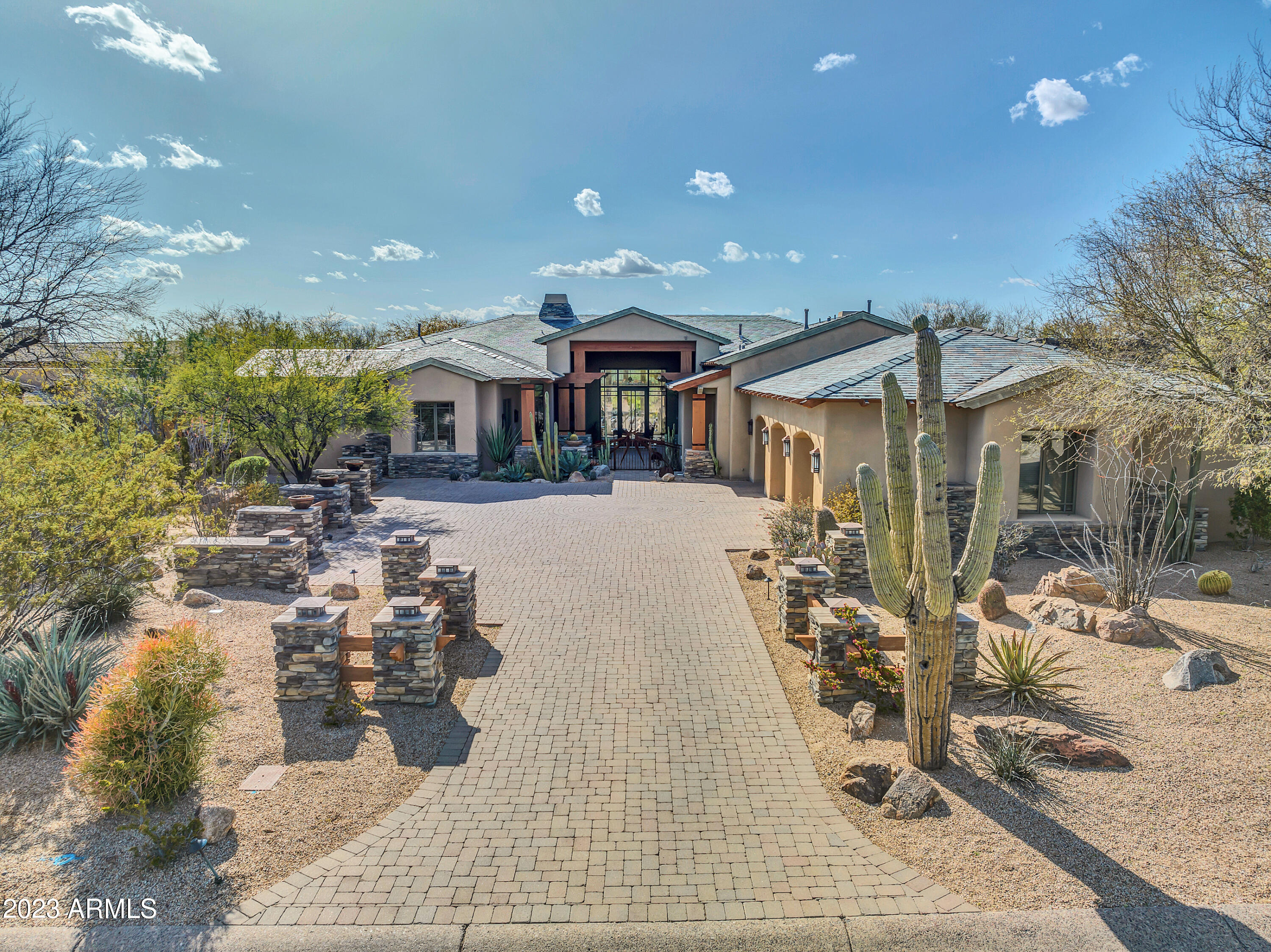 Golf Course and Mountain VIEWS in Grayhawk! AN EXQUISITE LABLONDE HOME RE-INTRODUCING THE 'ARTS & CRAFT' ARCHITECTURE OF THE 1910'S! ARTISTIC AND AESTHETICALLY ELEGANT FROM THE WELCOMING IRON GATE ENTRY TO THE UNIQUE SLATE ROOF TO THE EXTENSIVE USE OF WOODWORK (CUSTOM CABINETS, BEAMS, COLUMNS, DOORS, AND BASEBOARD) SET AGAINST COOL LIMESTONE FLOORS AND SURROUNDS TO A CHEF'S DREAM KITCHEN TO AN ELEGANT MASTER SUITE. OTHER LUXURIOUS FEATURES INCLUDE WET BAR, GUEST SUITES, POOL/SPA/WATER FEATURES, 4 FIREPLACES + MORE! Home is also available for lease, please inquire for leasing terms. Beautiful LaBlonde Custom Home on the golf course. HOME ON 3/4 ACRE OFF THE 6TH GREEN OF THE RAPTOR Golf Course.  Yes, there is a golf course view in the backyard.  Mountain views in the front yard. From the moment you enter the custom gate, you'll be mesmerized by the intricate details throughout this home, separating it from any other in the entire subdivision. Open floor plan makes this home great for entertaining, including a wet bar and formal dining room complete with cozy fireplace and fantastic views and exit to the incredible backyard. Gourmet kitchen complete w/ 2 dishwashers a warming drawer & butler's pantry; let's not forget a huge island w/ gas cooktop & separate sink. Dining area has additional custom built cabinets & custom chandelier. All bedrooms are ensuite, & the master has many extras including a wet bar, library, steam shower & fireplace. Entertainers backyard w/ pool/spa & built in bbq under a pergola. Enjoy gorgeous sunsets. Must see to appreciate!