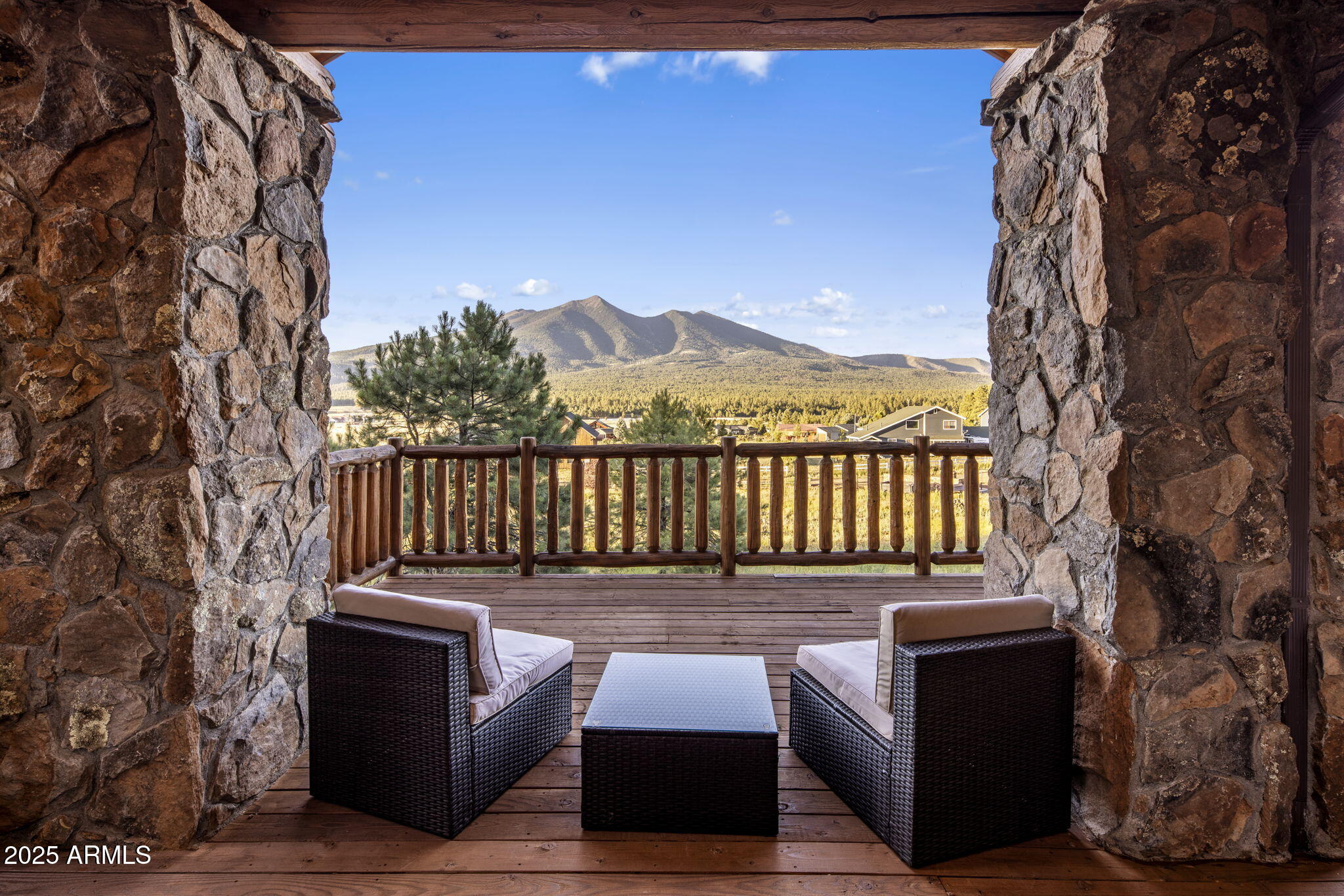 This isn't just a mountain home. It's a handcrafted chalet—six years in the making, sculpted from the highest peak in Montana and rooted in the heart of Flagstaff. Privately gated. 1.29 acres. Minutes to Snowbowl. But miles from anything ordinary.
The logs? Massive 12-inch Western timber—hand-peeled, hand-placed. No drywall, just raw wood and pure intention. Inside, every beam carries the fingerprint of craftsmanship. The fireplace? Faced in Malpais rock pulled straight from Flagstaff's volcanic soil. The same stone flows into a waterfall feature that hums like the forest after rain. The kitchen—designed by a 3-star Michelin chef. Bertazzoni steel. Granite counters. A gas range that turns cooking into performance. In this chalet, dinner is theater.Step into the owner's suite Step into the owner's suite through a timber log keyhole entrance. Inside, hand-carved river rock from Flagstaff runs across the bathroomMalpais again. Earthy, grounded, unforgettable.

Outside, coffee on the deck an expansive deck stretches over 50 feet wide your front-row seat to the San Francisco Peaks. It's where the sun sets in slow motion, painting the sky in gold and fire. And sometimes, elk wander past like they've lived here longer than we have.

And after a day on the slopes, the soaking tub lets you unwind with that same view. You're not just surrounded by natureyou're in rhythm with it.

Built by the owner. Inspired by wilderness. Elevated by detail.