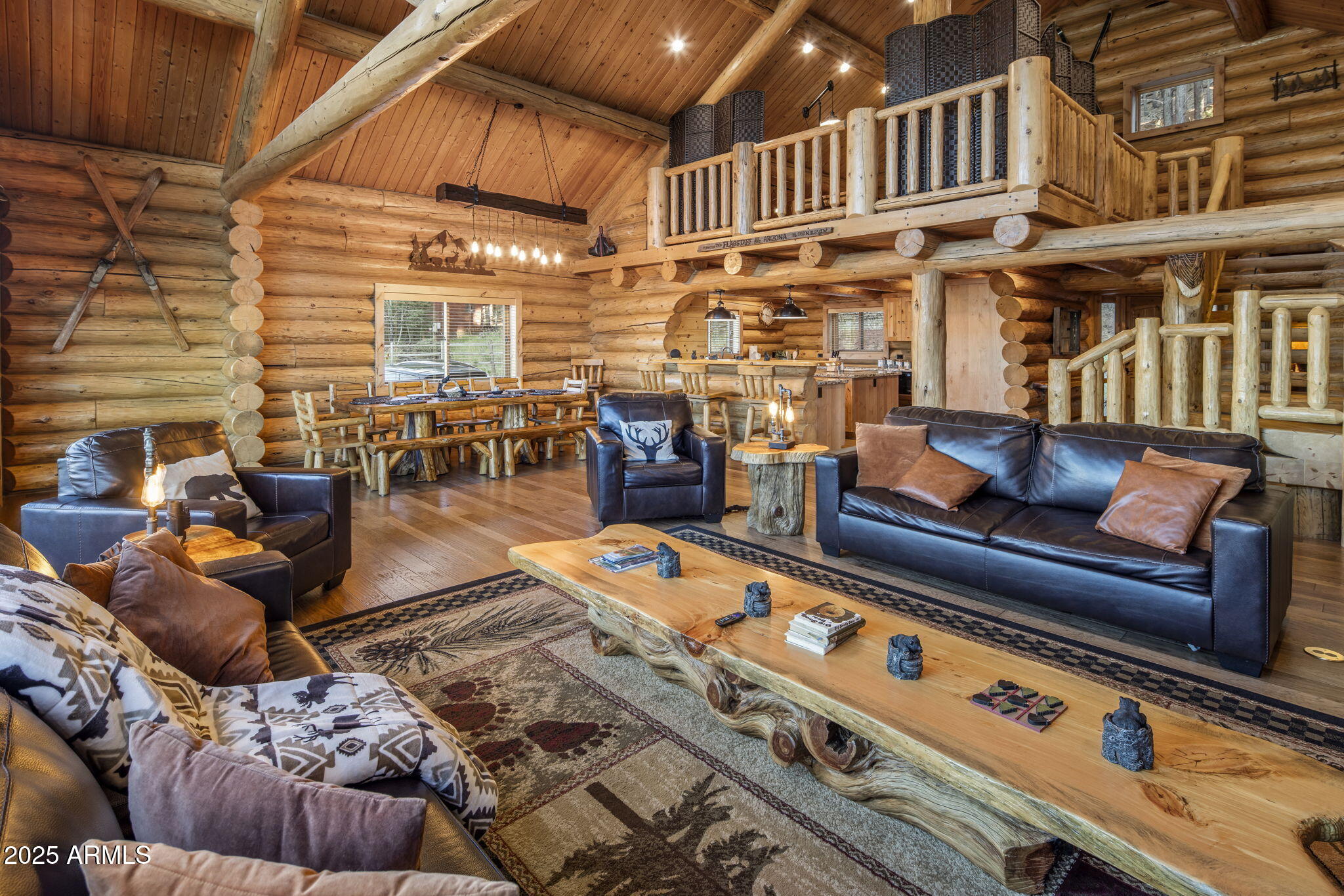 This isn't just a mountain home. It's a handcrafted chalet—six years in the making, sculpted from the highest peak in Montana and rooted in the heart of Flagstaff. Privately gated. 1.29 acres. Minutes to Snowbowl. But miles from anything ordinary.
The logs? Massive 12-inch Western timber—hand-peeled, hand-placed. No drywall, just raw wood and pure intention. Inside, every beam carries the fingerprint of craftsmanship. The fireplace? Faced in Malpais rock pulled straight from Flagstaff's volcanic soil. The same stone flows into a waterfall feature that hums like the forest after rain. The kitchen—designed by a 3-star Michelin chef. Bertazzoni steel. Granite counters. A gas range that turns cooking into performance. In this chalet, dinner is theater.Step into the owner's suite Step into the owner's suite through a timber log keyhole entrance. Inside, hand-carved river rock from Flagstaff runs across the bathroomMalpais again. Earthy, grounded, unforgettable.

Outside, coffee on the deck an expansive deck stretches over 50 feet wide your front-row seat to the San Francisco Peaks. It's where the sun sets in slow motion, painting the sky in gold and fire. And sometimes, elk wander past like they've lived here longer than we have.

And after a day on the slopes, the soaking tub lets you unwind with that same view. You're not just surrounded by natureyou're in rhythm with it.

Built by the owner. Inspired by wilderness. Elevated by detail.