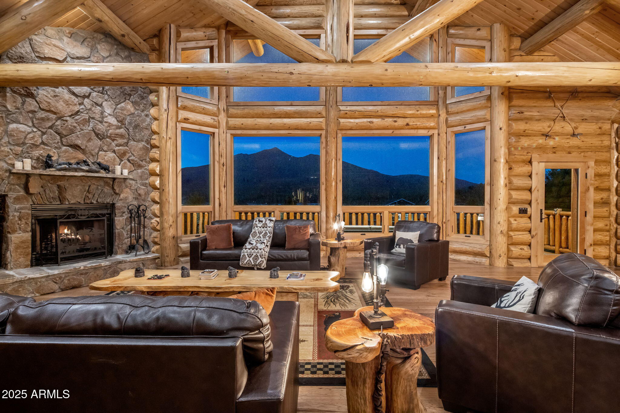 This isn't just a mountain home. It's a handcrafted chalet—six years in the making, sculpted from the highest peak in Montana and rooted in the heart of Flagstaff. Privately gated. 1.29 acres. Minutes to Snowbowl. But miles from anything ordinary.
The logs? Massive 12-inch Western timber—hand-peeled, hand-placed. No drywall, just raw wood and pure intention. Inside, every beam carries the fingerprint of craftsmanship. The fireplace? Faced in Malpais rock pulled straight from Flagstaff's volcanic soil. The same stone flows into a waterfall feature that hums like the forest after rain. The kitchen—designed by a 3-star Michelin chef. Bertazzoni steel. Granite counters. A gas range that turns cooking into performance. In this chalet, dinner is theater.Step into the owner's suite Step into the owner's suite through a timber log keyhole entrance. Inside, hand-carved river rock from Flagstaff runs across the bathroomMalpais again. Earthy, grounded, unforgettable.

Outside, coffee on the deck an expansive deck stretches over 50 feet wide your front-row seat to the San Francisco Peaks. It's where the sun sets in slow motion, painting the sky in gold and fire. And sometimes, elk wander past like they've lived here longer than we have.

And after a day on the slopes, the soaking tub lets you unwind with that same view. You're not just surrounded by natureyou're in rhythm with it.

Built by the owner. Inspired by wilderness. Elevated by detail.