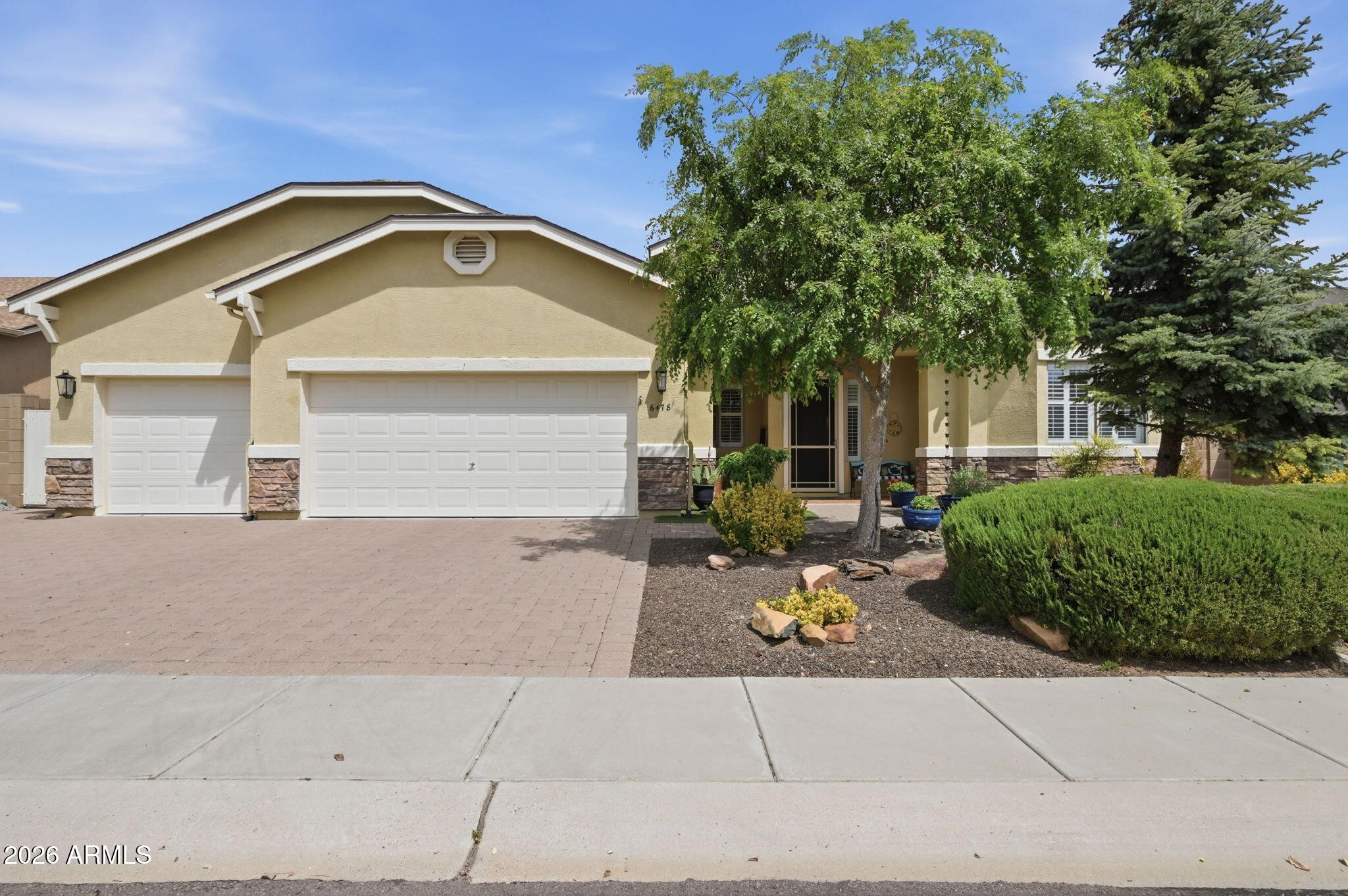 Must-see Granville home featuring a split floorplan that maximizes all 2,635 square feet - plus a 10x30 Arizona room with multiple sliding doors that's a great bonus, perfect for relaxing!  Tidy and attractive landscaping, driveway and sidewalk pavers, and a custom security door give good curb appeal.  Classic Beautifully maintained 4-bedroom, 3-bath home with an office, formal dining room, and 3-car garage in the heart of Prescott Valley! Pride of ownership shows throughout with a well-kept interior and charming curb appeal. Enjoy the spacious 10x30 Arizona room--perfect for relaxing, entertaining, or additional living space--not included in the listed square footage. The bakyard is a true retreat featuring lovely landscaping, a garden area, mature fruit trees, a gazebo, and a jacuzzi for year-round enjoyment. A peaceful outdoor setting with plenty of space to unwind and entertain. Conveniently located near shopping, dining, and local amenities, this home is a must-see!