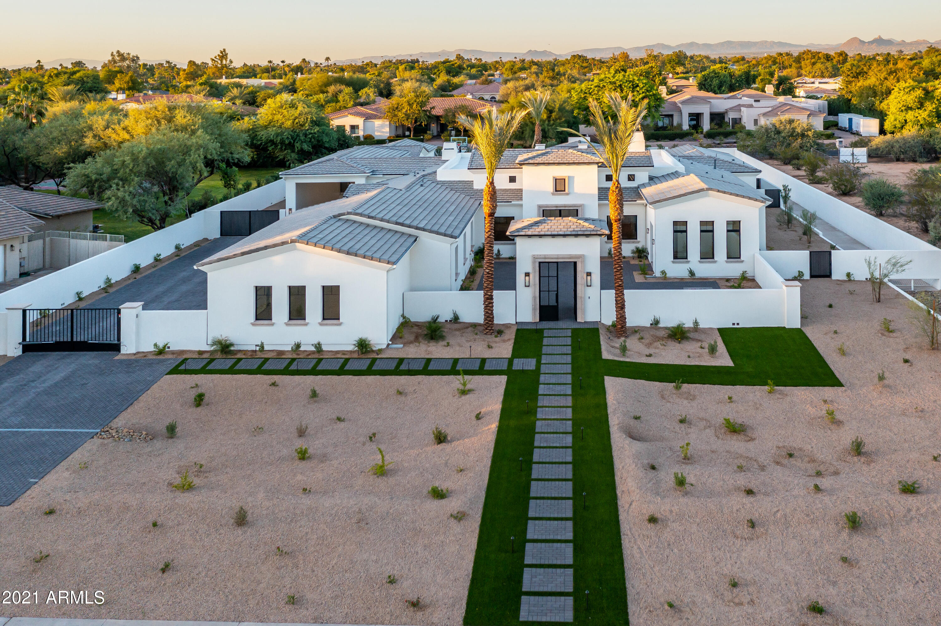 THIS HOME IS NOW COMPLETE, NEW PICTURES ARE BEING TAKEN WEDNESDAY. 
New Construction! Exquisite Gated Paradise Valley Custom Estate on Acre Plus lot by Award Winning Builder Gray Properties, Inc. Walking distance to fine dining, upscale shopping, resorts, spas, and golf courses. Wonderful mountain views, detached guest house, RV Garage, Gate House, Ramada, heated pool/spa with deck jets, sport court, putting green, built-in BBQ with sink, automated sliding pocket doors, view deck, wood beam ceilings, Brazilian Oak Wood Flooring, imported Mexican hand carved cantera stone at exterior entry, window sills, Shaker style ''White'' Alder Cabinets, chef's kitchen with Subzero Wolf appliances. Excellent PV schools. Desirable North/South lot
