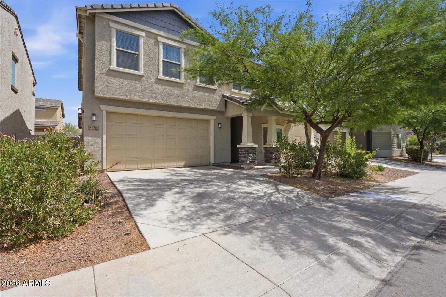This 2021-built home in the highly sought-after Sienna Hills at Verrado community offers nearly 2,500 square feet, 4 bedrooms, a den, a loft, and 2.5 bathrooms across a well-designed two-story layout. Just 5 minutes from the brand new Verrado Marketplace and close to the community park, this home offers space, style, and a great location.

The entryway features custom wall paneling throughout, with the den space downstairs. The main living area includes a built-in electric fireplace and a 12-foot sliding glass door that opens to the backyard, great for indoor-outdoor living in Arizona. The kitchen features grey cabinetry paired with a zellige-style tile backsplash for a fresh, modern feel. Upstairs you'll find all four bedrooms plus a spacious loft, perfect for a playroom, media room, or home office. The backyard features low-maintenance turf, generous outdoor space, and a playset that can convey, all just near the community pool too!

Additional features include energy efficient construction, modern finishes throughout, and a flexible layout designed for comfortable everyday living.