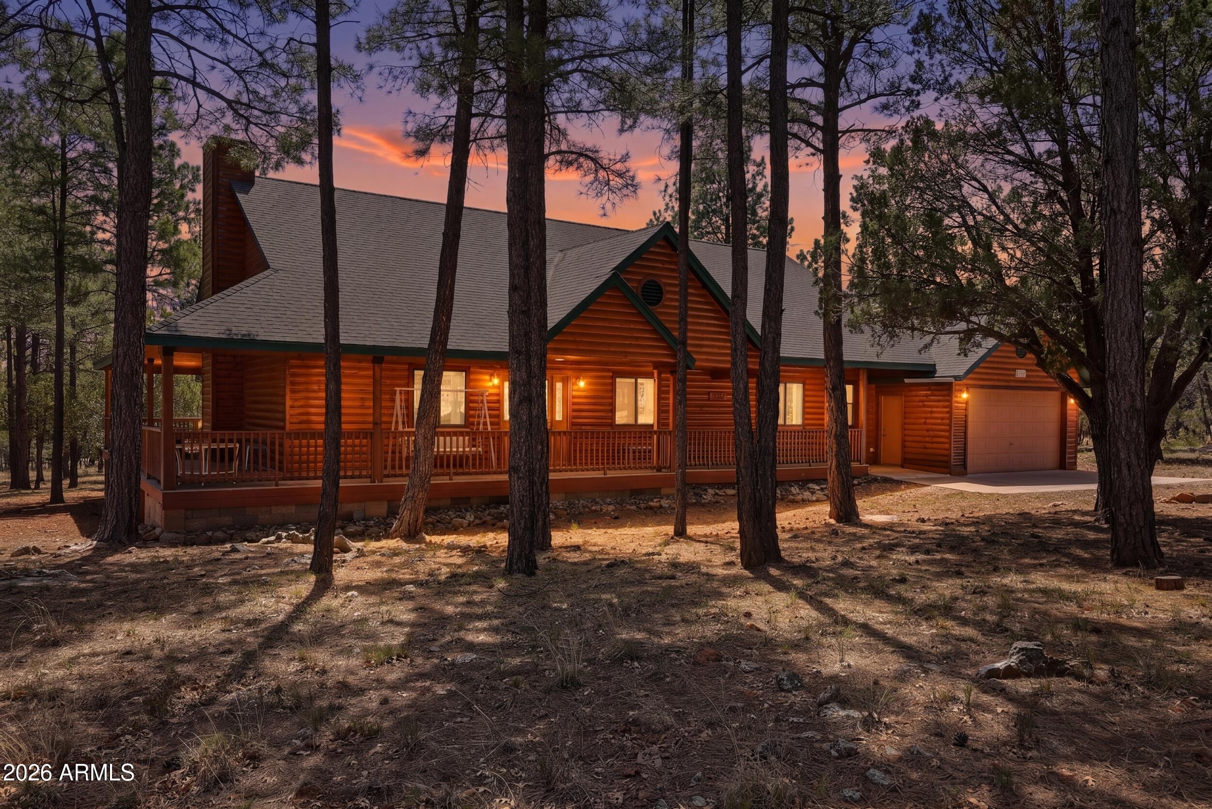 Looking to retire, move full time or just a weekend getaway this is the home for you. SINGLE level log sided home with a great 3 side  deck for enjoying the wildlife and looking at the stars.  This home offers alot of hand carved wood work throughout showing the quality and love put into it.  3 bdrm/ 2 bath convenience for everyone, no stairs inside. Large open floor plan easy to entertain inside or out. Beautiful wood floors and newer carpet in bedrooms, move in and start enjoying. Sit by the large gas fireplace for that cozy family night or relax on the deck with a cup of coffee or glass of wine. Sits on a nice treed lot at the end of the cul de sac for lots of privacy. 2 car extended length garage  with cabinets and workbench, great for a workshop or game area, nice man cave.
