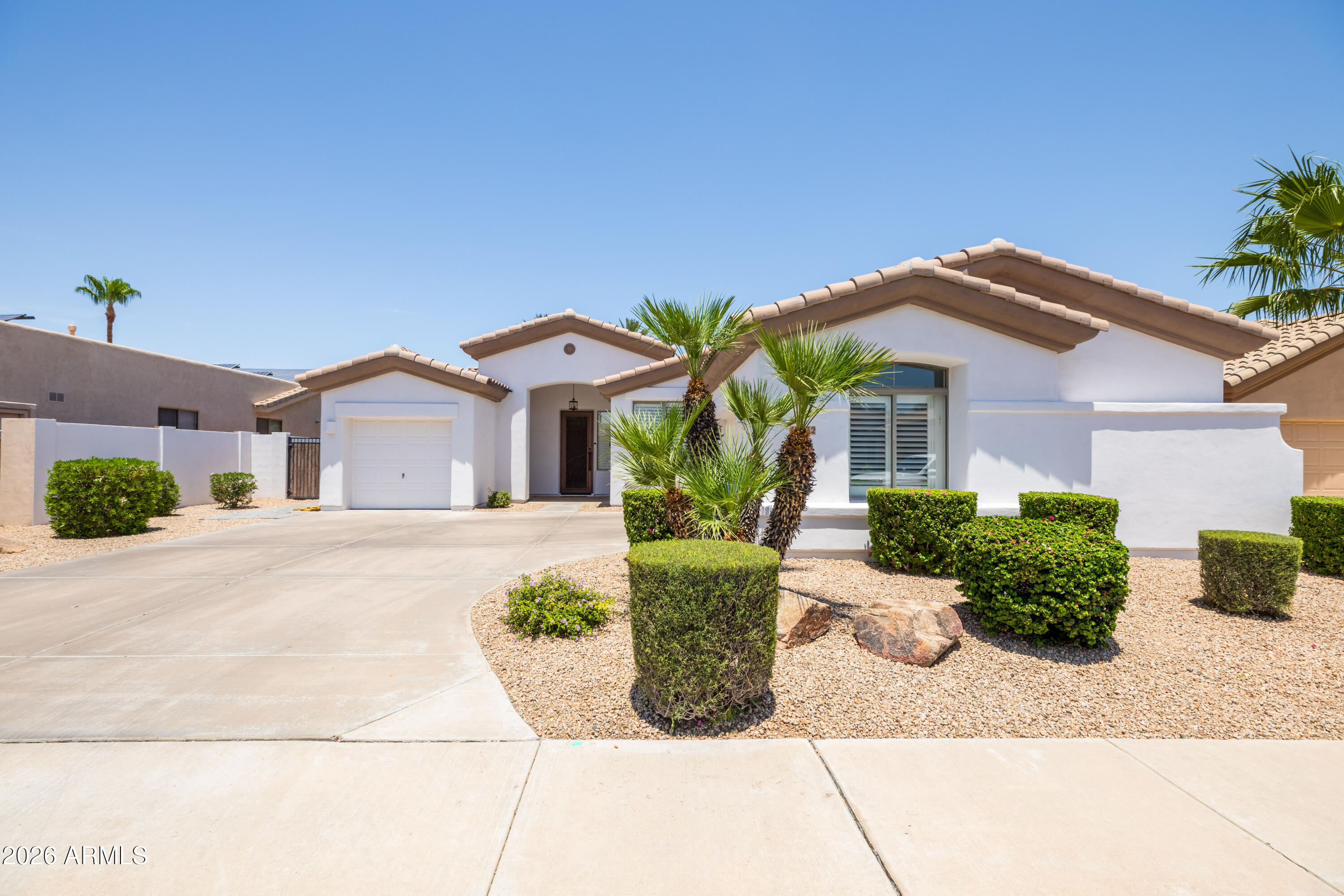 Pull up to this delightful, move-in-ready single-story home in Goodyear, Arizona, just minutes from the prestigious Wigwam Golf Resort and Goodyear Shopping walking distance to grocery store. Freshly refreshed landscaping sets the tone for serene living in this sought-after community. Offering 3 bedrooms plus a versatile den/office and 2 full baths across 2,360 square feet, this thoughtfully updated residence blends comfort and modern style seamlessly.

Step inside to gleaming new tile flooring and bright, freshly painted interiors that welcome you warmly. The brand-new kitchen is a chef's dream, complete with a built in Boos Cutting board table top featuring an inviting eat-in space perfect for everyday meals and entertaining. Cozy up by the gas fireplace on cooler evenings, and enjoy t benefits of a reverse osmosis system and water softener already installed.

This home has been meticulously cared for with a new roof, newer HVAC units, and enhanced insulation for year-round efficiency. The remodeled master bath and crisp exterior paint complete the picture of quality and care.
Outside, your private retreat awaits with an enclosed patio offering additional outdoor living space. Relax under the newer covered gazebo, thoughtfully designed with a dedicated location for a TV, perfect for watching sports while overlooking the sparkling pool and spacious yard with low-maintenance artificial turf.

Experience comfort, style, and thoughtful updates in a Goodyear home near Wigwam Golf Resort, ready for you to move in and enjoy. Reach out today to preview this exceptional property and start your next chapter here.