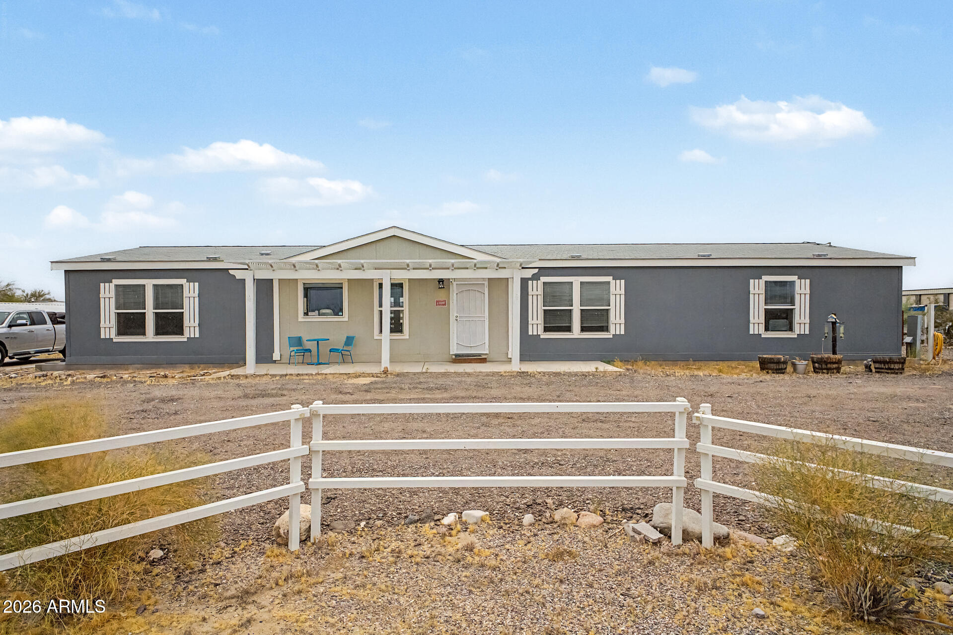 ASSUMABLE at 3.6%!  Fantastic opportunity to own this sprawling 1-acre horse property on a coveted corner lot! NO HOA, and NOT 55+! You're welcomed by a sizeable front yard, a circular driveway, and a front patio that sets an inviting tone. Discover an inviting open layout with a cool palette, a striking wood feature wall, blinds, and wood-look flooring. The eat-in kitchen comes with crisp white cabinetry, recessed lighting, built-in appliances, and a peninsula with a breakfast bar. The main bedroom includes a private bathroom with dual sinks and a practical walk-in closet. Unwind in the backyard, complete with a covered patio for outdoor relaxation. You'll be delighted by existing equestrian facilities, a large arena, stalls, a convenient RV gate, and a barn shed for additional storage. Not to mention all the benefits of solar without the monthly payment!  Don't miss out on this gem.