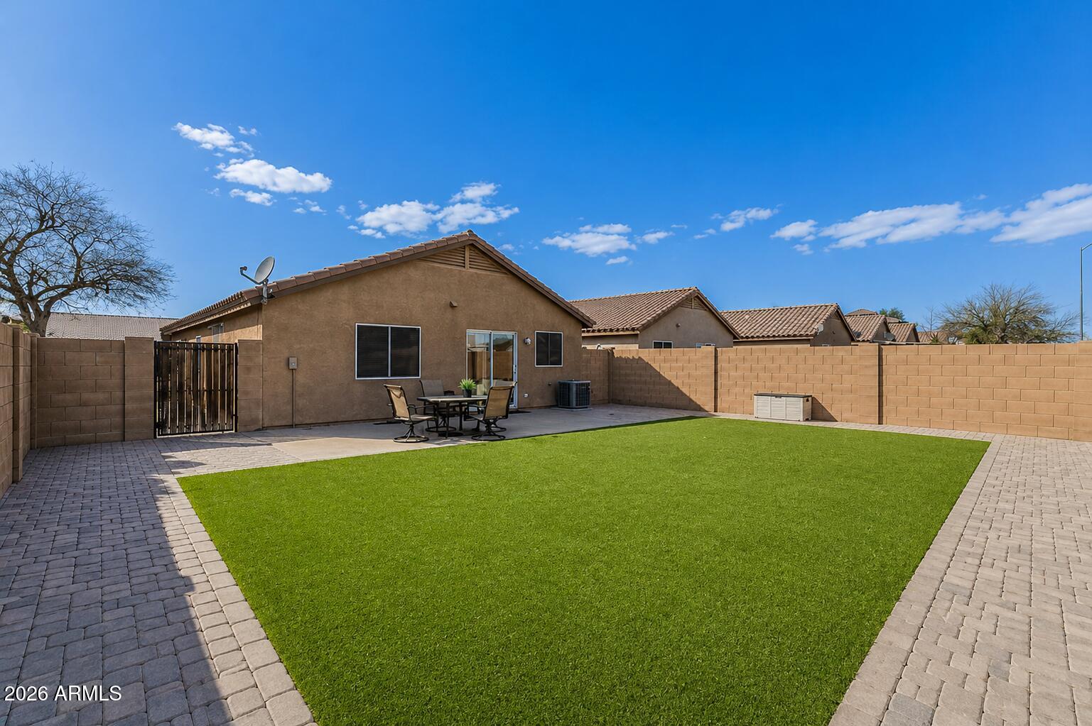 Assumable VA Loan - Pristine 3-Bed Gem in El Mirage - Energy Efficient & Move-In Ready! Pride of ownership shines in every detail. This 3-bedroom, 2-bathroom home features over 1,000 sq. ft. of perfectly designed living space with modern wood-look tile flowing throughout (installed 2019). The heart of the home is an eat-in kitchen complete with oak cabinets, a walk-in pantry, and vaulted ceilings that create an airy, open feel.
Save significantly on your monthly utilities with the leased solar panels! Outdoor living is a breeze with a large backyard featuring lush grass, mature citrus trees, and a spacious patio for grilling. The two-car garage includes a built-in workbench and shelving for all your projects.