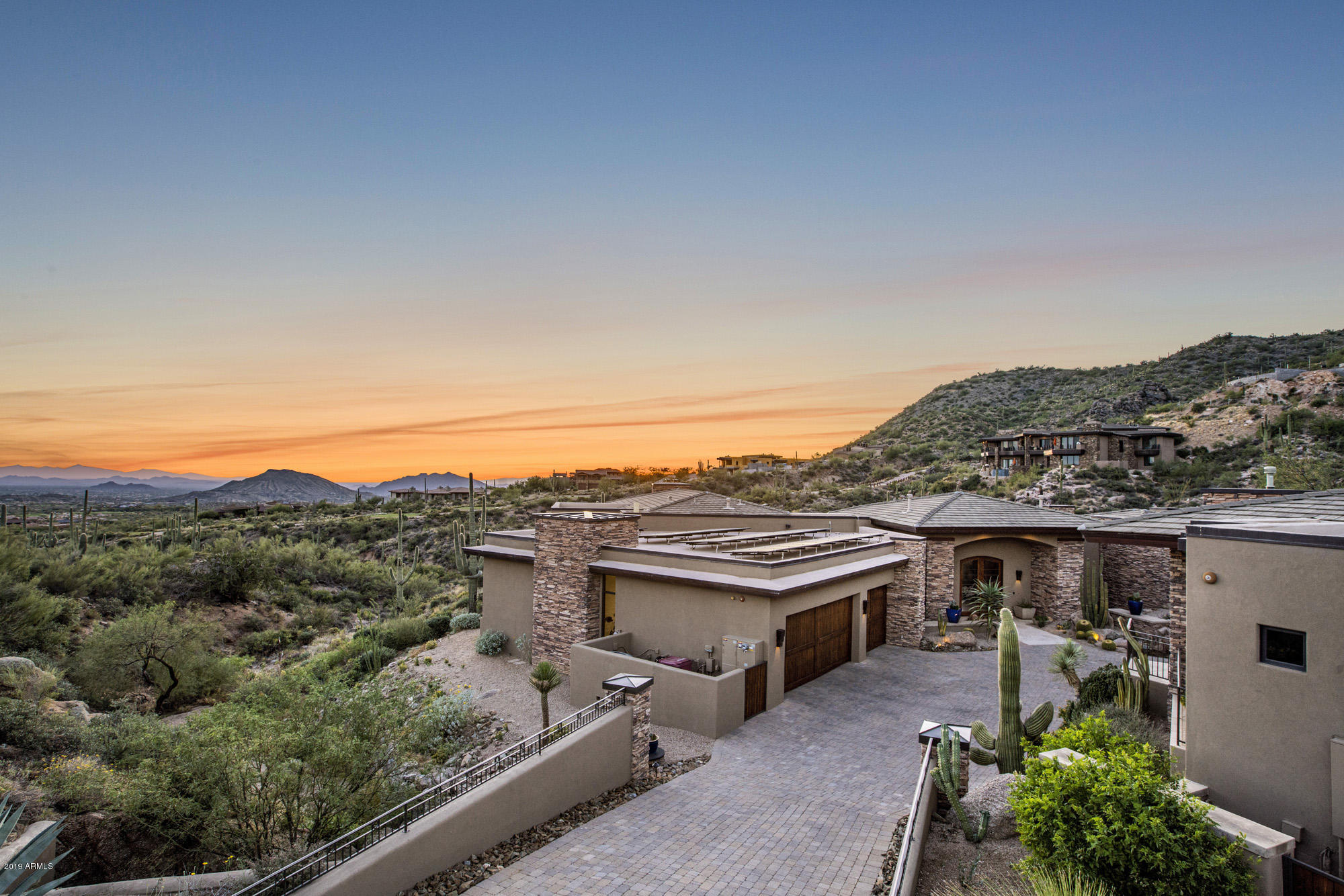 Resort living in Desert Mountain at its finest. Long private driveway with courtyard, pool & spa. This hillside home sits at a 3,360 ft elevation to provide dramatic views of the city & surrounding mountains. The main house features 4,972 SqFt with 3 beds, 4.5 baths, office & wine cellar. The chefs kitchen will wow you, your family & guests with it flowing straight into the great room and extended to indoor/outdoor seating. Across the courtyard is a spacious casita with 2 guest suites, living room & kitchenette. Numerous upgrades to create a new home feel include: fully remodeled master suite, interior/exterior paint, outdoor kitchen, oak flooring, commercial grade 800 amp panel, owned solar panels, Tesla supercharger, water filtration system, Control4 smart home automation & much more. The Desert Mountain Club is one of the most prestigious clubs in the country & features: 6 Jack Nicklaus Signature Golf Courses, a par-54 golf course, Jim Flick Golf Performance Center, 7 clubhouses, 10 restaurants, 9 USTA-certified tennis courts, state of the art fitness center, pools, spa, 15 miles of hiking trails & more.
