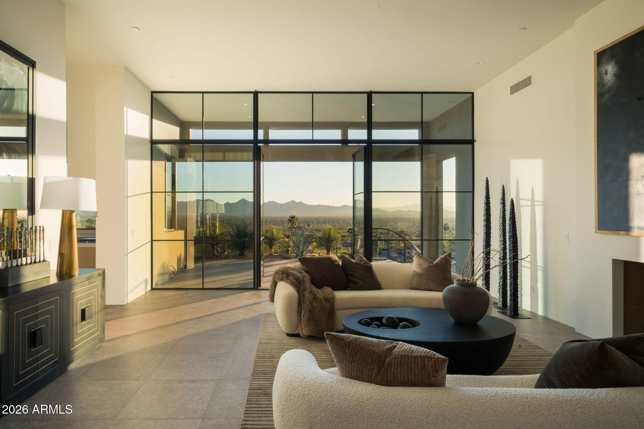 Occasionally, a legacy property comes to market that captures some of the very best views Paradise Valley has to offer. Nestled in nature, this incredible hillside home w/private detached guest house below offers peace and tranquility on the highest point of prestigious Hummingbird Lane. Features include:  Floor to ceiling glass, expansive window walls thru-out with premium quality construction & finishes: Double wall design w/15'' thick steel & concrete exterior walls + int. framing, the latest tech-engineering propelled the design. Wired for full automation; Hi-speed Tesla chargers in His & Her garages. Circular Entry court that allows Parking for 6+ cars. The 5600 sq ft main home is one of a kind. Cradled by Mummy Mountain, it blends into the landscape seamlessly with unobstructed views of Pinnacle Peak, the McDowell's, Four Peaks and Superstition's. The newly constructed lower level 1016 sq ft private guest casita mirrors the style and finish of the main home. The pool and outdoor entertaining areas are surrounded by native desert landscape providing a one of a kind setting. An opportunity to acquire a very special property in one of Paradise Valley's best enclaves.