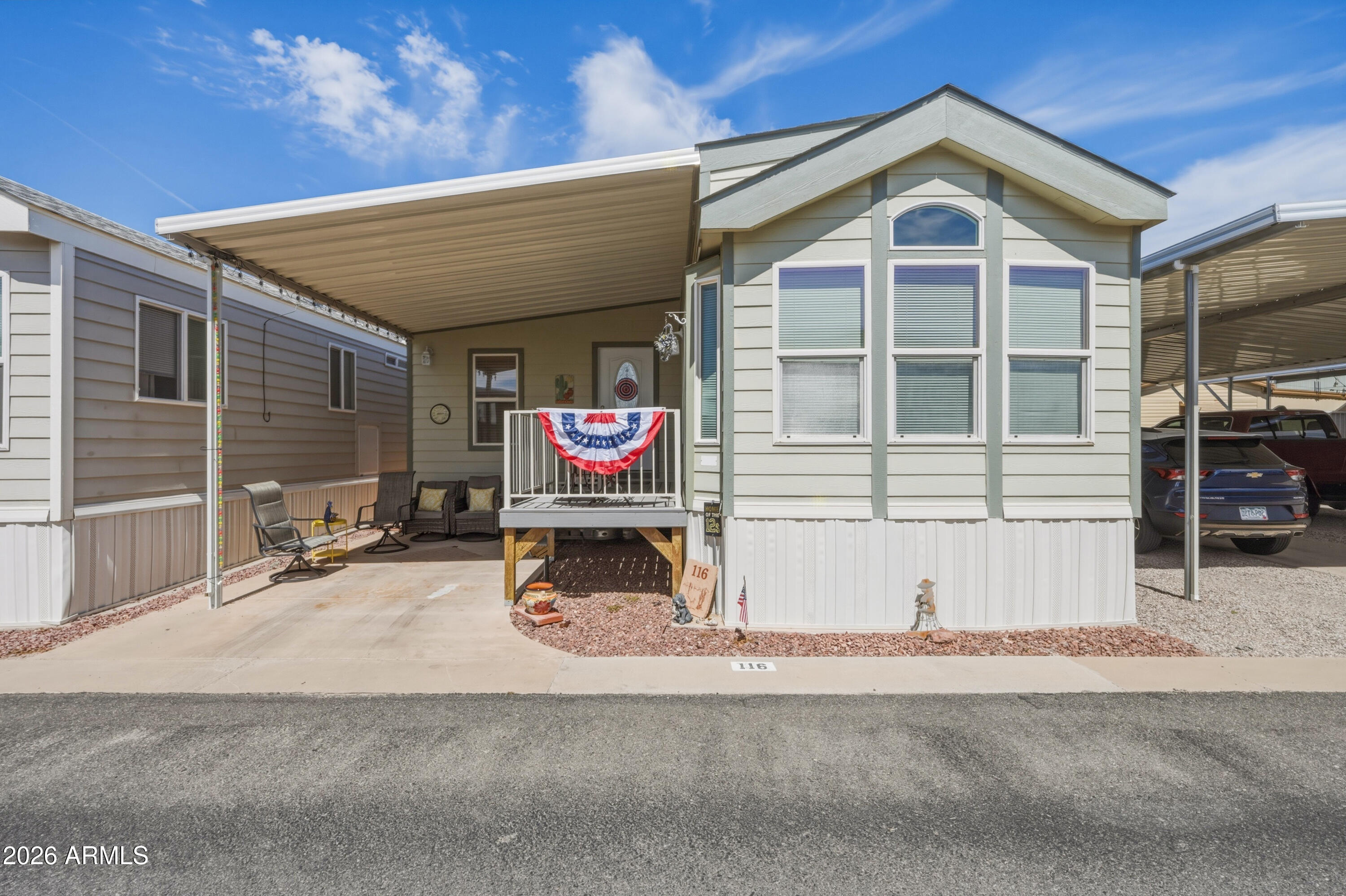 Looking for a 1-bed park model in Florence AZ with extra space and RV hookups? This 2009 Cavco park model in Caliente Casa De Sol offers 363 sq ft plus an Arizona room approx 222 sq ft and 1.5 baths. The home features wood-look linoleum flooring, a kitchen with electric stove, refrigerator, and built-in microwave, and a primary bedroom with built-in desk. Stackable washer and dryer are included. Recent updates include A/C replaced in 2025 and a roof coating approximately two years ago. The sale includes a second parcel, 110 E Mesquite (APN #200-66-020) (MLS 6998945) located two lots west of the home. That lot includes a Tuff Shed workshop with workbench and electric, covered carport, and RV setup with full hookups. Both lots must be sold together for $135,000 Residents of Caliente Casa De Sol enjoy community amenities including heated pools and spas, clubhouse, fitness center, pickleball courts, billiards room, library, organized activities, and social events, creating an active lifestyle in Florence.