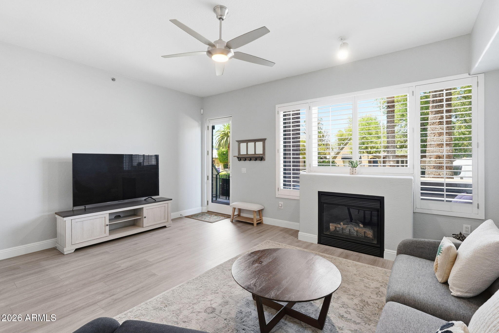 Best location in Tapestry, with a north facing patio adjacent to the leafy Willo historic neighborhood - step out your door and walk through the charming neighborhood, with coffee shop and restaurant adjacent; amazing for dog owners! Remodeled kitchen, new flooring, freshly painted throughout. Both spacious bedrooms are ensuite, with a powder bath downstairs. Primary suite with remodeled bath including tile shower, dual vanities, walk in closet and balcony. 2 garage spaces. Laundry room in unit. Updated HVAC. Tapestry offers excellent amenities including pool, spa, fitness, onsite management. Light rail within 2 minutes walk. Perfect opportunity to live downtown with a low maintenance lifestyle, yet nestled in a historic walkable neighborhood.