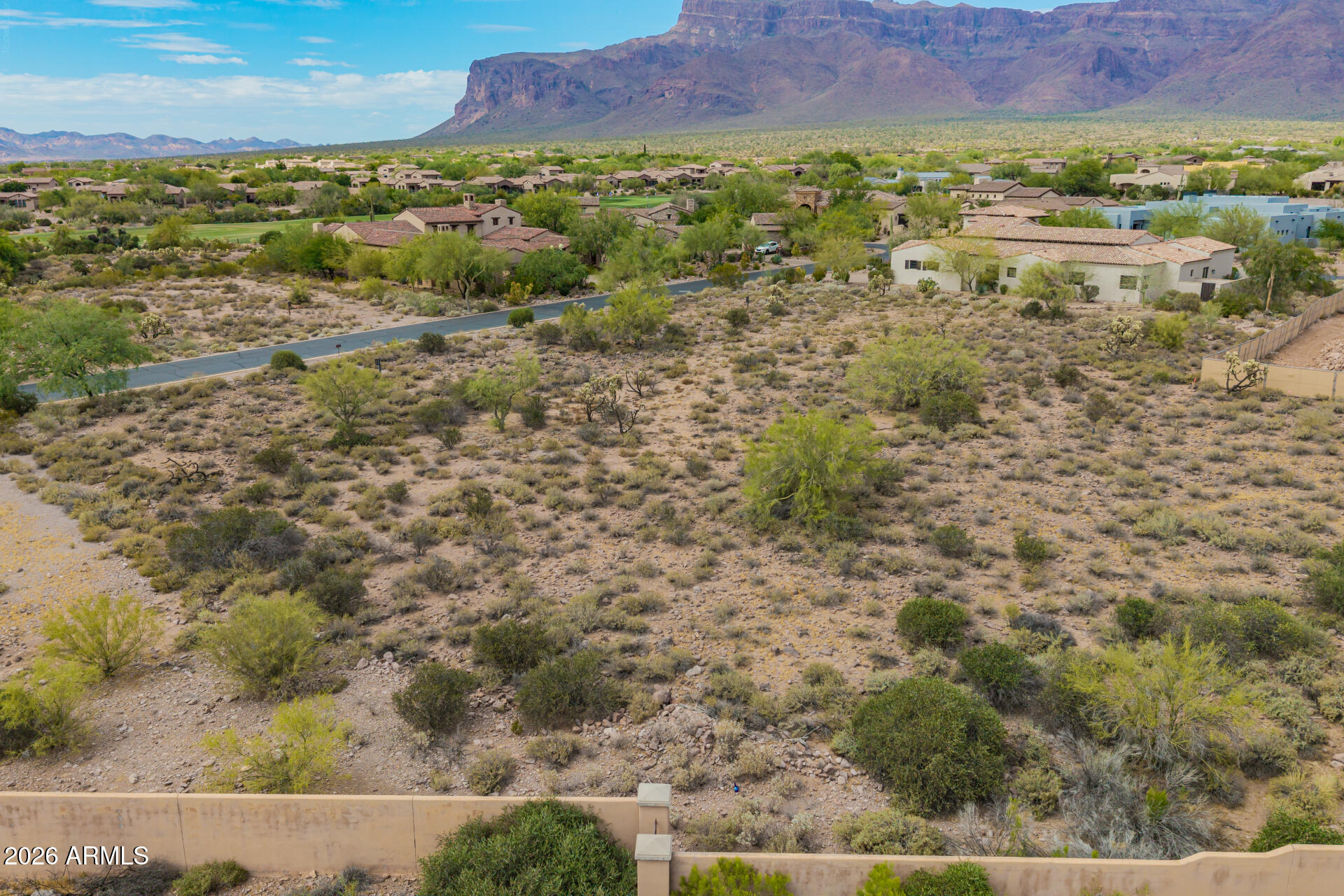 Premier location in Superstition Mountain Golf & Country Club in Gold Canyon, the East Valley's best kept secret! This .53 acre lot is an easy, flat build site surrounded by amazing custom homes. LOT 45 IS AVAILABLE NEXT DOOR; BOTH CAN BE PURCHASED AND COMBINED FOR A FULL ACRE HOMESITE. There is no required build time so you can plan your project on your own timeframe. Country Club living at its finest, you'll enjoy two 18 hole pristine golf courses, a 50,000 sf Clubhouse with fine and casual dining, fitness center, tennis and pickleball, bocce ball, planned activities, nearby hiking, walking trails and so much more. When you enter these gates, it feels like home! Come see all this area has to offer, you'll be happy you did! Membership options are available under separate agreement.