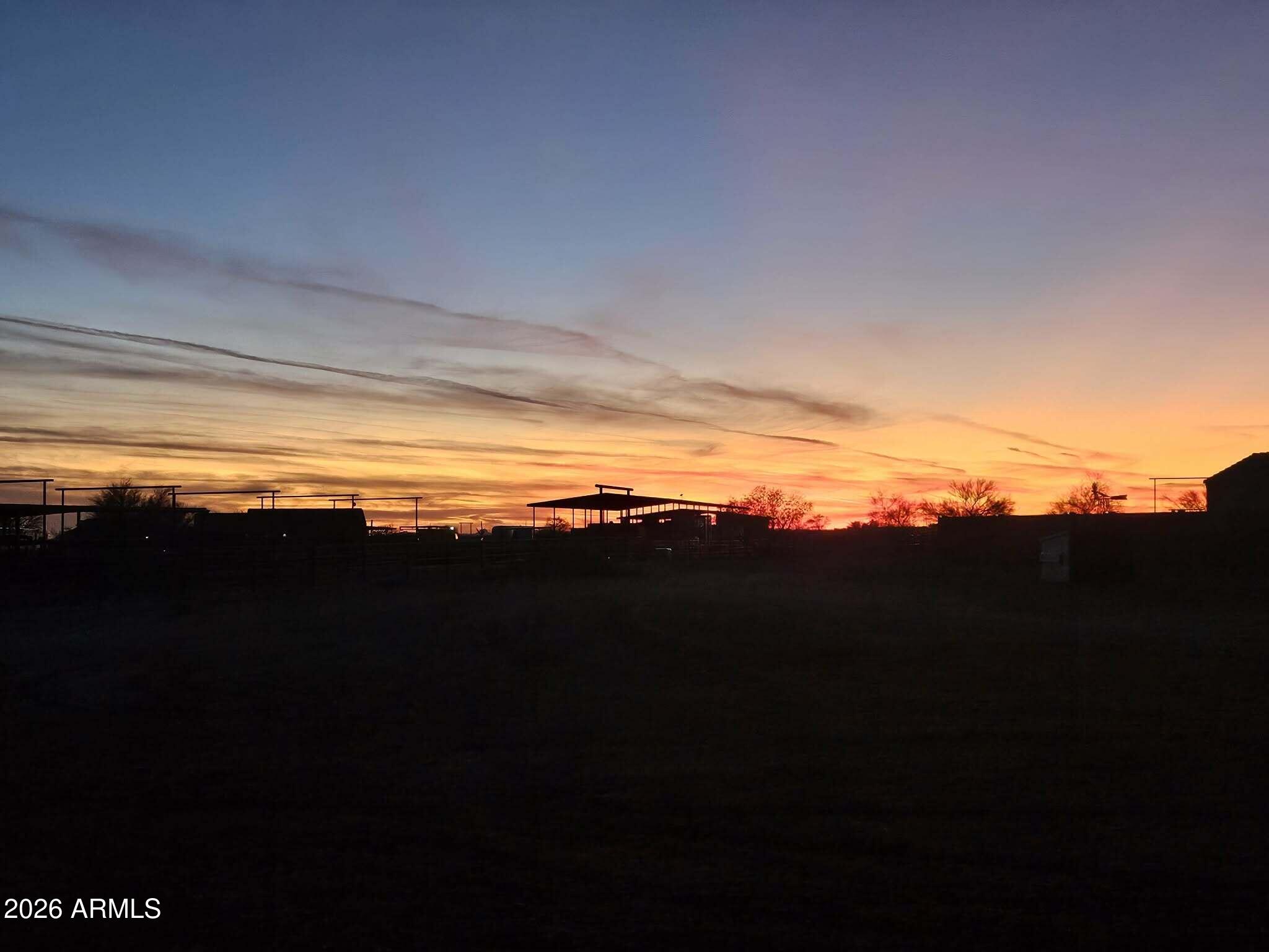 Discover the perfect canvas for your dream home in Wittmann, Arizona! This is a sprawling, flat, vacant lot that's partly clear and ready for development. Restricted to site built homes, this property provides ample space, whether you're looking to build a private residence with breathtaking mountain views or explore agricultural opportunities. Situated within a community known for its team roping and horse owners, the property caters not only to those with equestrian interests but also to anyone seeking a slice of serene rural life. The land comes with easy access and a shared well, Whether you're a cowboy or simply yearn for open spaces and star-filled skies, this property has it all. The possibilities are as limitless as the horizon, so saddle up and let your imagination gallop!