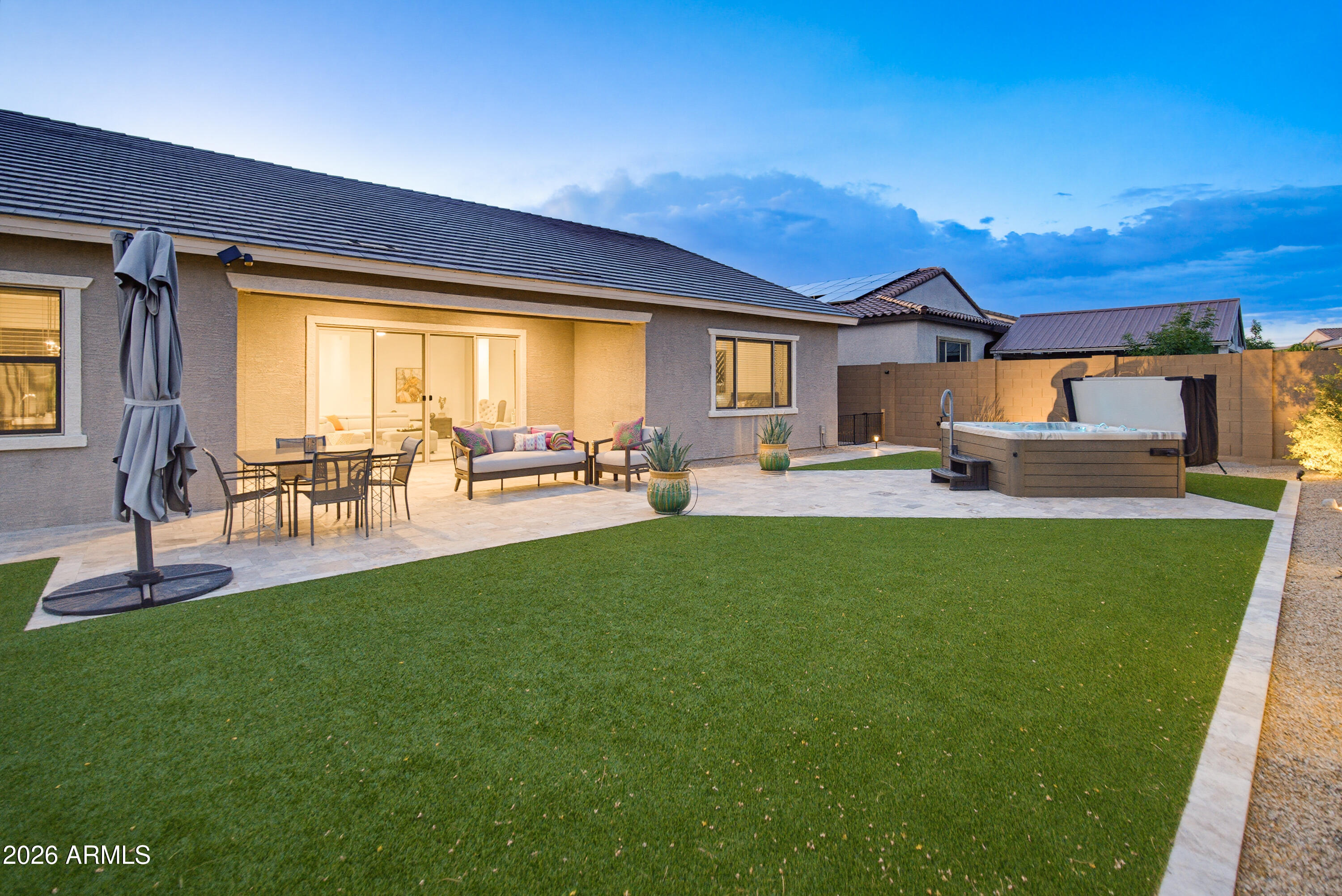 Welcome to this stunning single level 4 bedroom, 3 bath home in the highly sought after and newest gated Sonoran Foothills community, Copperleaf. Only 3 years old, this single-story home offers an open-concept floor plan filled with natural light. Gourmet kitchen featuring quartz counters, stainless steel appliances, a large island, ample storage, and all appliances included. The split floor plan provides privacy with a spacious primary suite, dual vanities, oversized walk-in shower, and dual walk-in closets. Enjoy all-tile flooring with no carpet. Guest bedrooms open to a large family room offering endless possibilities for entertaining, work, or play. Relax in your private backyard featuring a spa, artificial turf, covered patio, low-maintenance landscaping, and a 3-car garage. Gourmet Kitchen includes amazing range and hood.  It's a monogram Smart Double Oven Gas Range with Steam-Cleaning Convection Oven in Stainless Steel. It has a built in griddle, and six burners.  Truly a chef's range, it even has heating lamps in the hood!  All monogram appliances and a beverage/wine chiller
