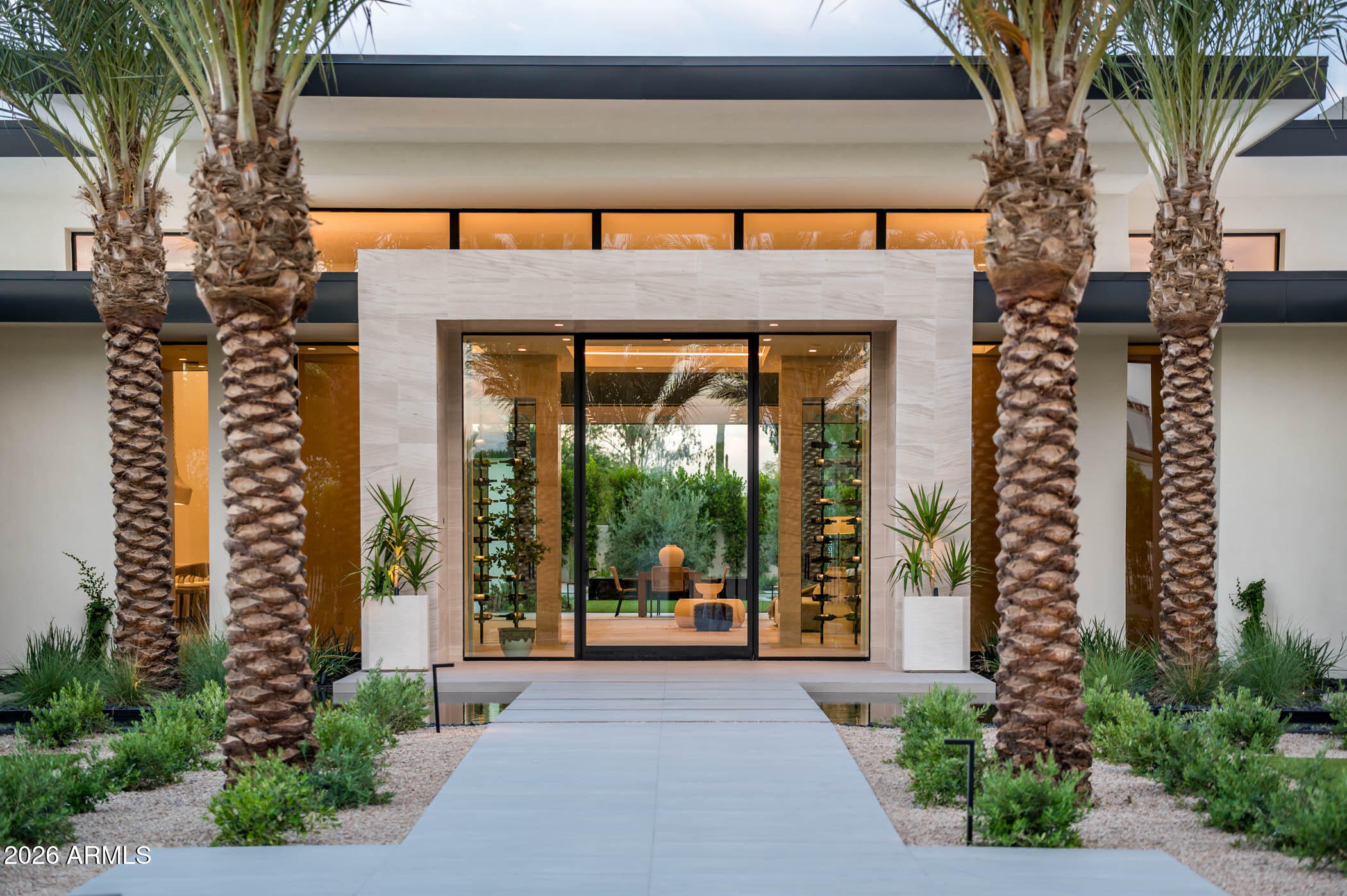 Introducing a rare opportunity to own a one-of-a-kind modern estate designed and built by award-winning Yonker Custom Homes. Thoughtfully crafted for elevated living and effortless entertaining, this cutting-edge residence blends striking architecture with world-class amenities and exceptional attention to detail.

Designed by Refined Gardens, the resort-style backyard is a true desert oasis featuring a crystal-clear pool, lush landscaping, and a dramatic black perimeter overflow spa that serves as both a stunning water feature and architectural focal point. Expansive pocket doors create seamless indoor-outdoor living, connecting the great room to the outdoor entertaining spaces while framing breathtaking views of Camelback Mountain. A striking double-sided fireplace anchors the great room, bar, and game room, creating an inviting atmosphere for gatherings of any scale.

The chef's kitchen is designed to impress, featuring premium appliances, exceptional finishes, and a fully equipped back kitchen that allows for effortless entertaining and discreet preparation.

The home offers five spacious ensuite bedrooms, each with walk-in closets, thoughtfully arranged in a split floor plan that provides privacy between the owner's retreat and guest accommodations. The guest suite is exceptionally appointed, offering the scale, comfort, and finishes typically reserved for a primary suite.

A detached casita adds incredible versatility, serving as a luxury fitness studio, showroom-style two-car garage with full glass pocket doors, executive office, and additional guest quarters.

The owner's suite is a private sanctuary featuring a custom oversized closet and a spa-inspired bath highlighted by a massive steam shower that opens to a tranquil outdoor shower garden complete with a water feature and private cold plunge.

Opportunities to own a home of this caliber are exceedingly rare. Reach out to your agent today to arrange a private consultation with the builder and learn more about this extraordinary residence.

OWNER/AGENT.