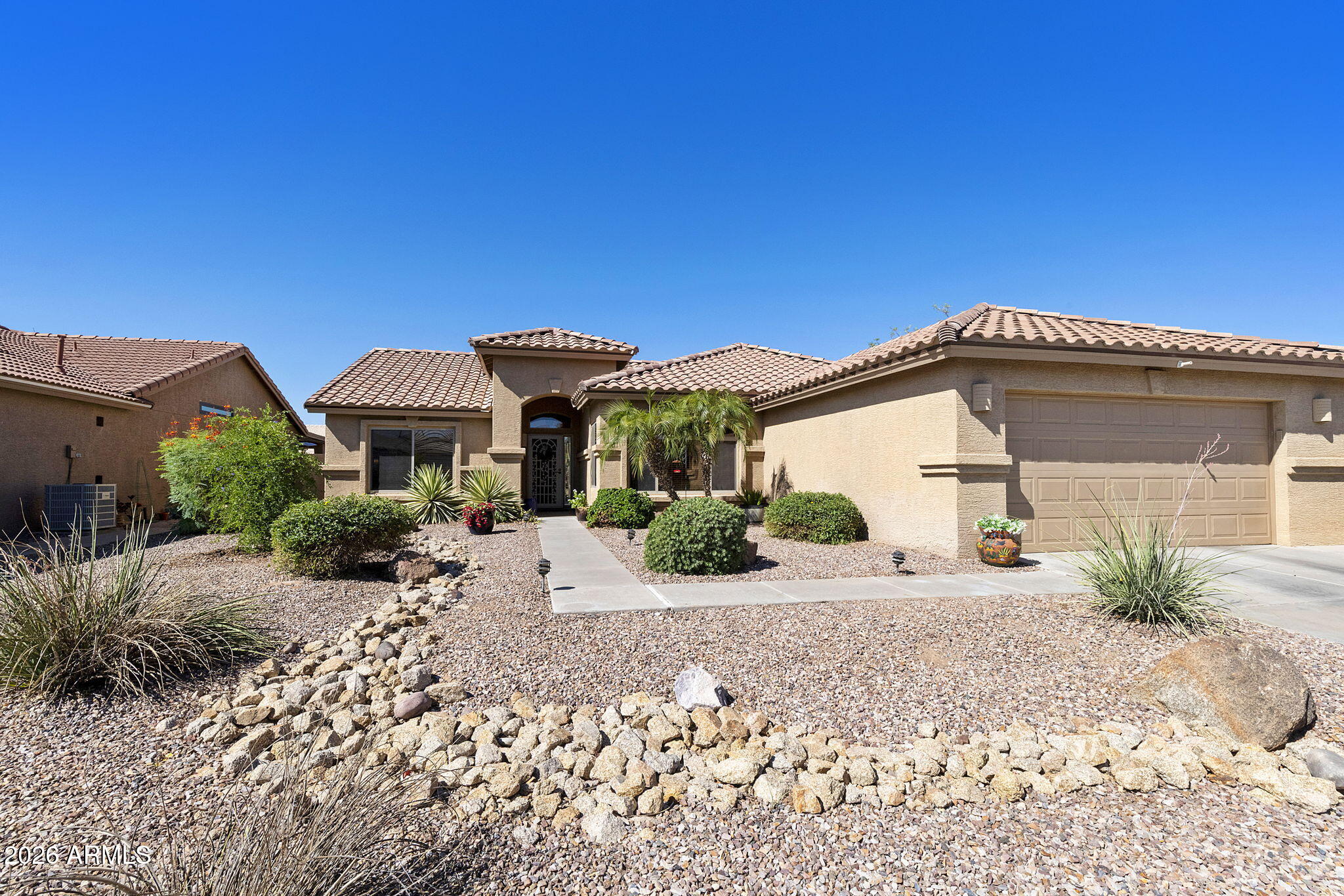 Most popular extended 2BR, 2BA plus den Palmera floorplan on a quiet street near the clubhouse in the desirable active adult community of Oakwood at Sun Lakes. Great curb appeal w/stacked stone accents. Great room w/soaring vaulted ceilings & patio access. Kitchen off the great room w/breakfast area, granite counters & SS appliances. Primary suite w/extended bay windows, updated tile walk-in shower and huge custom closet. Spare bedroom w/extended bay windows as well is split for maximum guest privacy. Backyard w/character, mature landscaping, hot tub pad, and covered patio w/misters. New roof in 2025, new AC in 2017. Don't miss out on this one! Start enjoying the countless amenities of IronOaks with golf, tennis, pickleball, pools, fitness, two great restaurants and a clubs for any hobby!