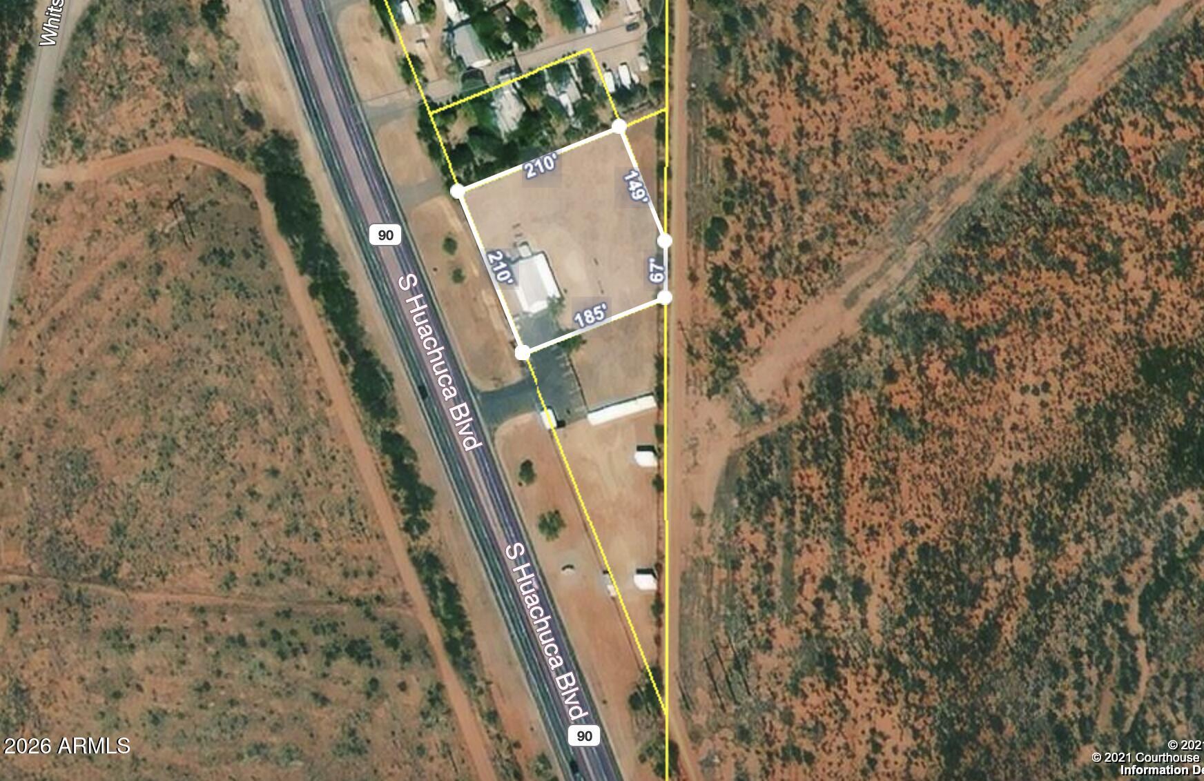 451.9' of Frontage on hwy 90! Last parcel within the city limits. Completely fenced in total of three parcels. They include 106-57-021, 106-57-022, 106-57-029. Well, septic, propane and electric all included. Unaffixed 1996. Manufactured home, with 4 offices, 2 ba (one ADA compliant), kitchen and covered porches off front and back. AC included.  Newer flooring. Newer metal roof, storage shed, 10 space paved parking. Ready for your vision.
