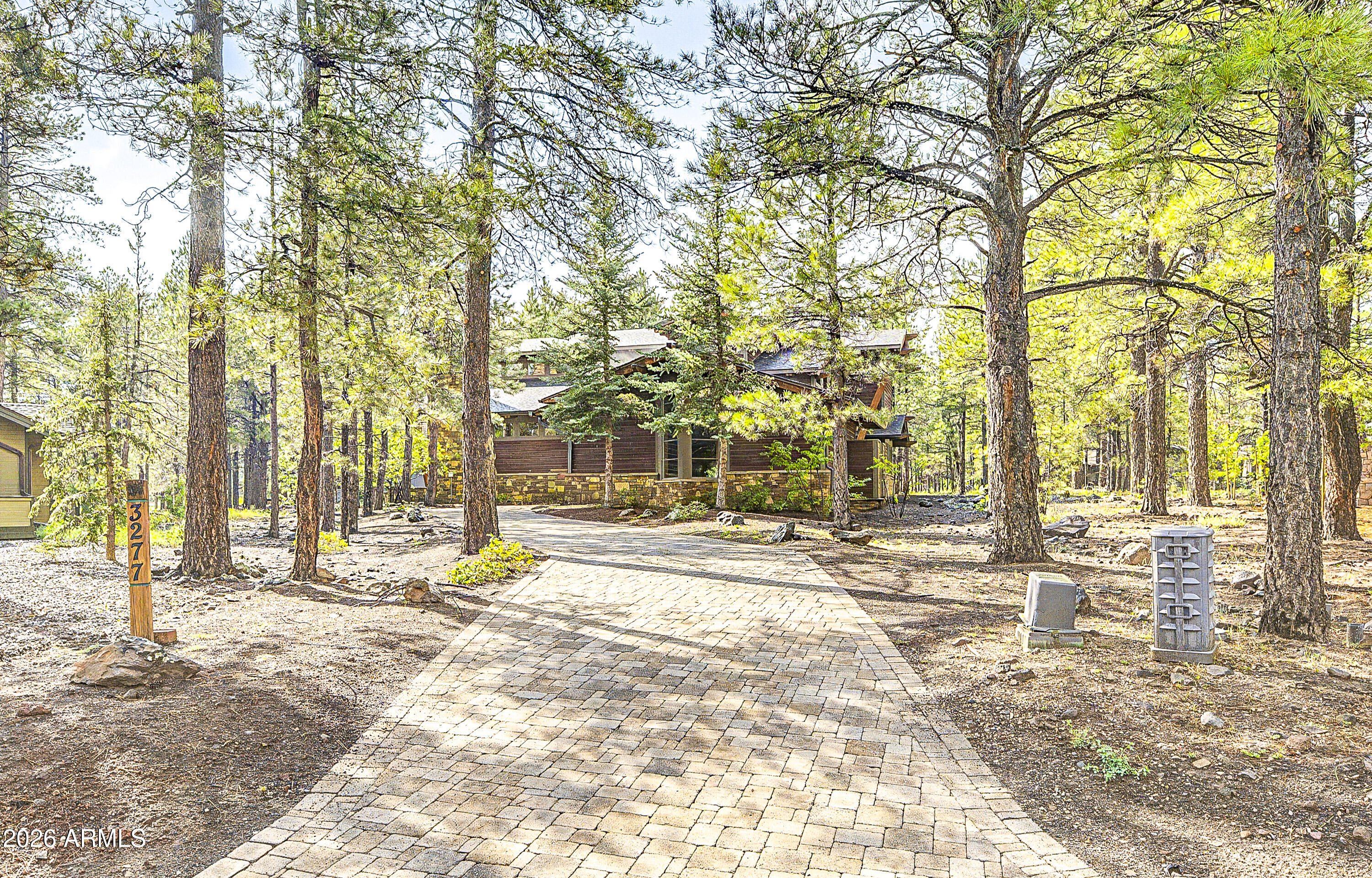 Spectacular Brent Kendle Design home just listed for sale to discriminate buyers seeking architectural excellence in Forest Highlands. Rare opportunity to secure one of the most magnificent homes in FH without paying for excess square footage. This 4,021 sq. ft. home has 5 bedrooms, an exercise studio suitable for an office or playroom. Incredible master suite, multi-head shower provides a spa like experience. Unique stone fireplace, contemporary staircase, craftsman-built cabinets, country sink, glass tiles and other finishes that give this home that little extra special feel. Unique combination of quality build and finishes, imaginative design and efficient use of space. New roof- Summer 2026.