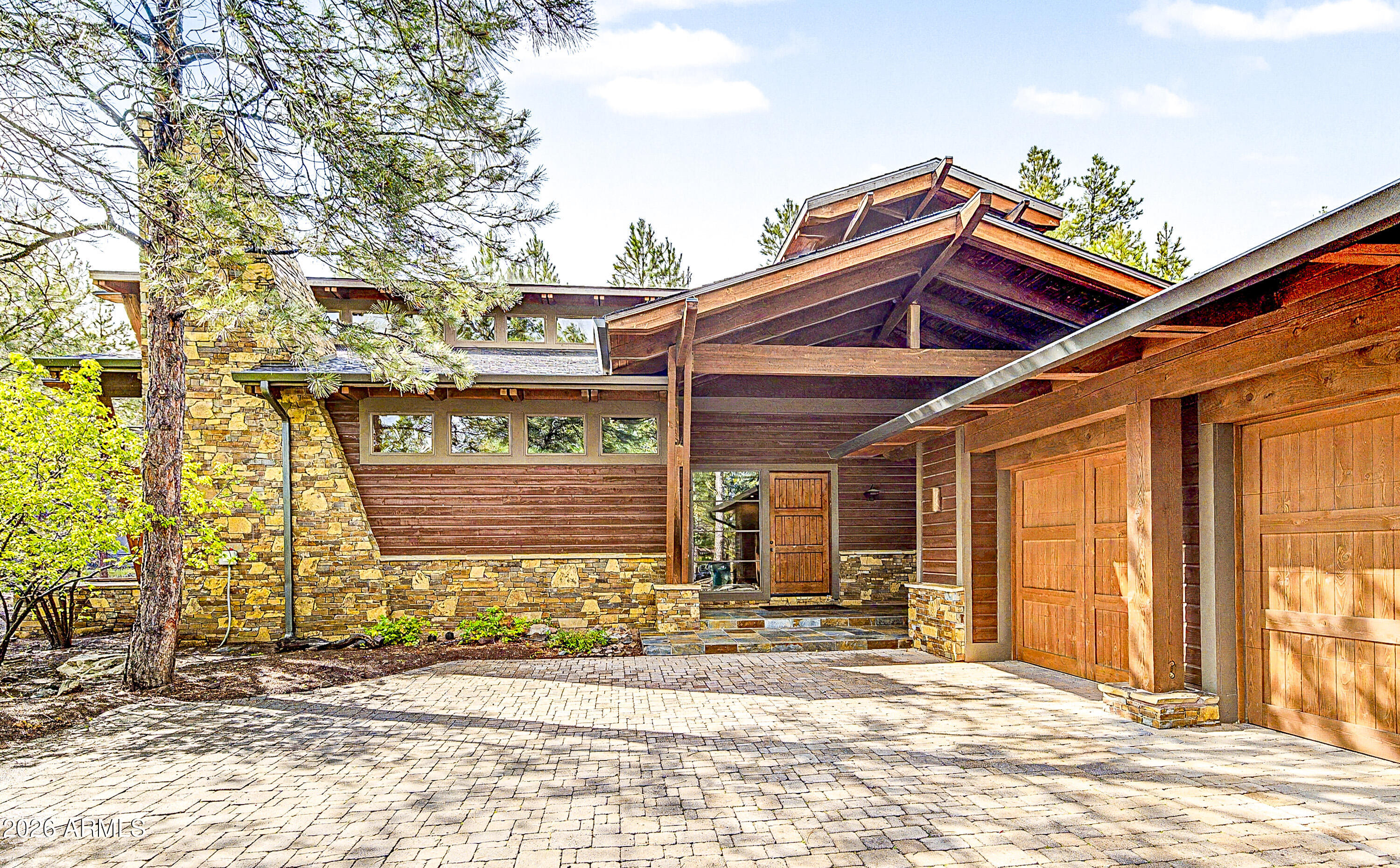 Spectacular Brent Kendle Design home just listed for sale to discriminate buyers seeking architectural excellence in Forest Highlands. Rare opportunity to secure one of the most magnificent homes in FH without paying for excess square footage. This 4,021 sq. ft. home has 5 bedrooms, an exercise studio suitable for an office or playroom. Incredible master suite, multi-head shower provides a spa like experience. Unique stone fireplace, contemporary staircase, craftsman-built cabinets, country sink, glass tiles and other finishes that give this home that little extra special feel. Unique combination of quality build and finishes, imaginative design and efficient use of space. New roof- Summer 2026.