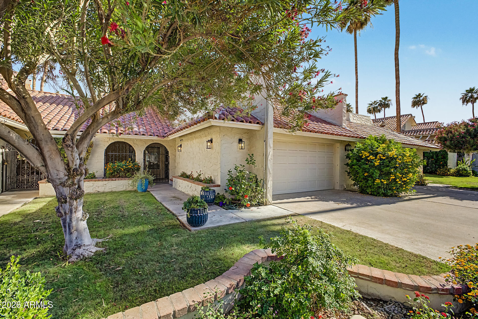 Offering the perfect blend of elegance, convenience, and low-maintenance living, this exceptional Villa de Fuente residence embodies the coveted Paradise Valley Lifestyle. This thoughtfully updated home features 3 spacious bedrooms, 2.5 baths, soaring vaulted ceilings with exposed beams, and designer finishes throughout. The desirable floor plan includes a ground-floor primary suite complete with a new custom closet and built-in dresser. The Gourmet Kitchen showcases stunning Taj Mahal Quartzite countertops, new custom soft-close cabinetry, and a newly installed gas line. Recent upgrades include a 2023 HVAC system, stunning 48-inch Natural Stone Tile flooring, and carpeting. Relax on the resurfaced balcony overlooking the sparkling community pool with iconic Camelback Mountain views. Ideally located near world-class dining, luxury shopping, golf, and entertainment, this lock-and-leave home offers Resort-Style Living in the heart of Paradise Valley.