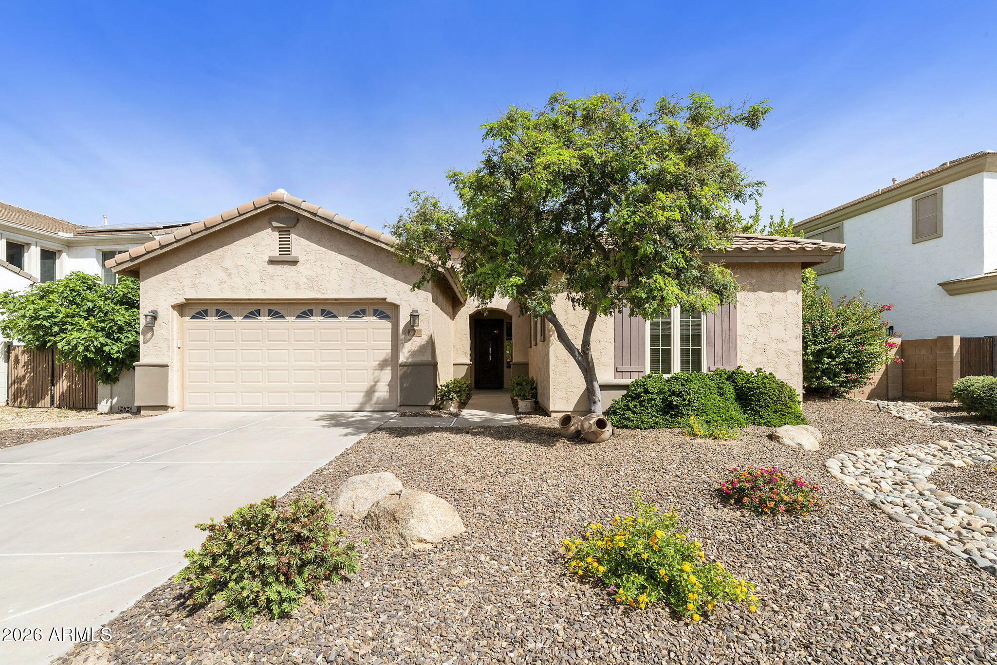 Charming and move-in ready Tatum model in the highly desirable Sun Groves community of Chandler! This 3-bedroom, 2.5-bath home offers a warm and inviting layout with a cozy fireplace and spacious living areas perfect for everyday living and entertaining. The large primary suite is a true retreat, featuring a dual vanity, separate soaking tub, and walk-in shower. Step outside to your private oasis with a sparkling pool and serene backyard-ideal for relaxing or hosting guests. Located in a peaceful, family-friendly neighborhood with walking and biking paths, a children's playground, and access to the highly acclaimed Chandler school district. This home combines comfort, charm, and convenience in one fantastic package!