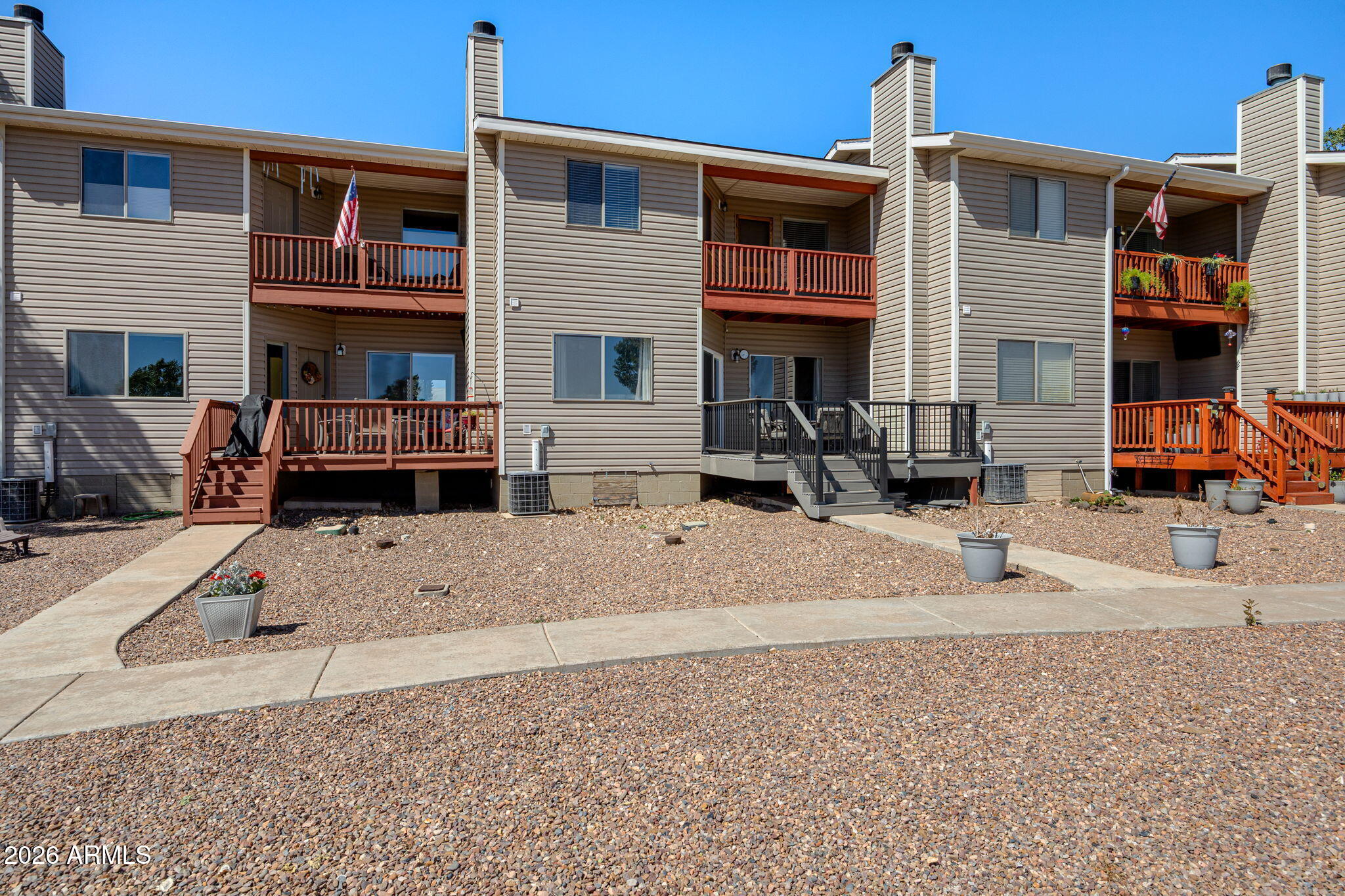 This is a rare opportunity to own prime lakefront property on exclusive White Mountain Lake in Arizona's breathtaking White Mountains. This move-in-ready 3-bedroom, 2-bath townhouse sits on a desirable lot right on the water and boasts many recent upgrades throughout. It offers beautiful lake views and is perfectly suited as a tranquil primary residence, cherished second home, or high-income vacation rental ready to generate revenue from day one, and ALL furniture stays with the home! 
Step outside to enjoy a brand new Trex patio, multiple balconies, and three decks total for outstanding outdoor living and relaxation. The White Mountain Lakes community offers an unbeatable lifestyle with a large sandy beach featuring shaded ramadas, world-class fishing, kayaking, paddleboarding, and unrestricted boating--including speedboats and jet skis. Just minutes from the conveniences of Show Low and the charming shops and restaurants of Pinetop-Lakeside, this peaceful retreat masterfully combines seclusion with everyday accessibility. Don't miss this exceptional chance to create lifelong memories in one of the White Mountains' most coveted lakefront settings!