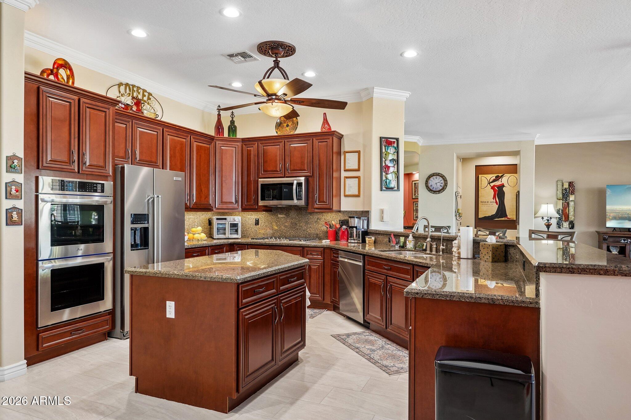 Welcome to the 5th green and a golf course view to savor, through a wall of glass. This updated Mirada offers value additions galore, starting with a foyer entrance that captures the view amid a classy den, wet bar, and wide-open great room. The updated kitchen, with a walk-in pantry and new appliances, boasts granite tops and a gas cooktop, immediately beckoning the family chef. Crown moldings, plantation shutters, custom master shower, low-e windows, high ceilings, big tile....and more. Yes, FULLY PAID OFF SOLAR, your benefit to reap!  Located in a gated community and less than a minute from a gated exit. Did I mention the extra powder room, or the separate golf cart garage? Surround sound extended to the exterior covered patio, Cool Decking, pavers, a fountain feature. See it today!