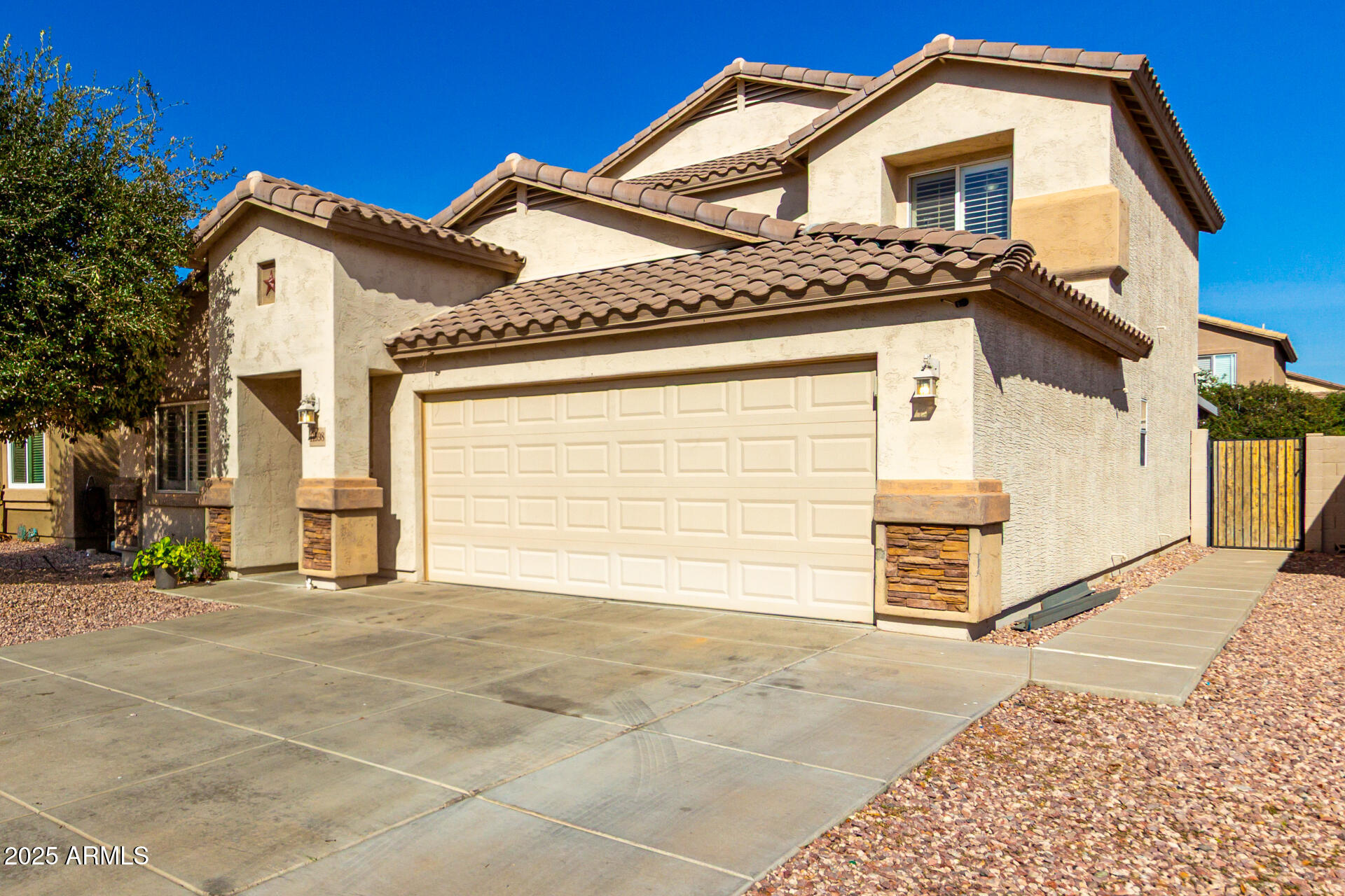 Stunning 4-bed, 2.5-bath with sparkling pool & water feature. Move-in ready with downstairs primary suite, stainless steel kitchen, island, plantation shutters, French doors & ceiling fans. Upstairs: huge loft/game room, 3 beds & full bath. Pool oasis w/ new pump/vacuum (2023), extended patio & widened driveway (+4 ft). Tile, carpet & wood-look floors. Near Luke AFB, Westgate & Dysart Unified schools. N/S exposure, dual-pane windows, play pool! Only 10 min to State Farm Stadium & Westgate--see it today!