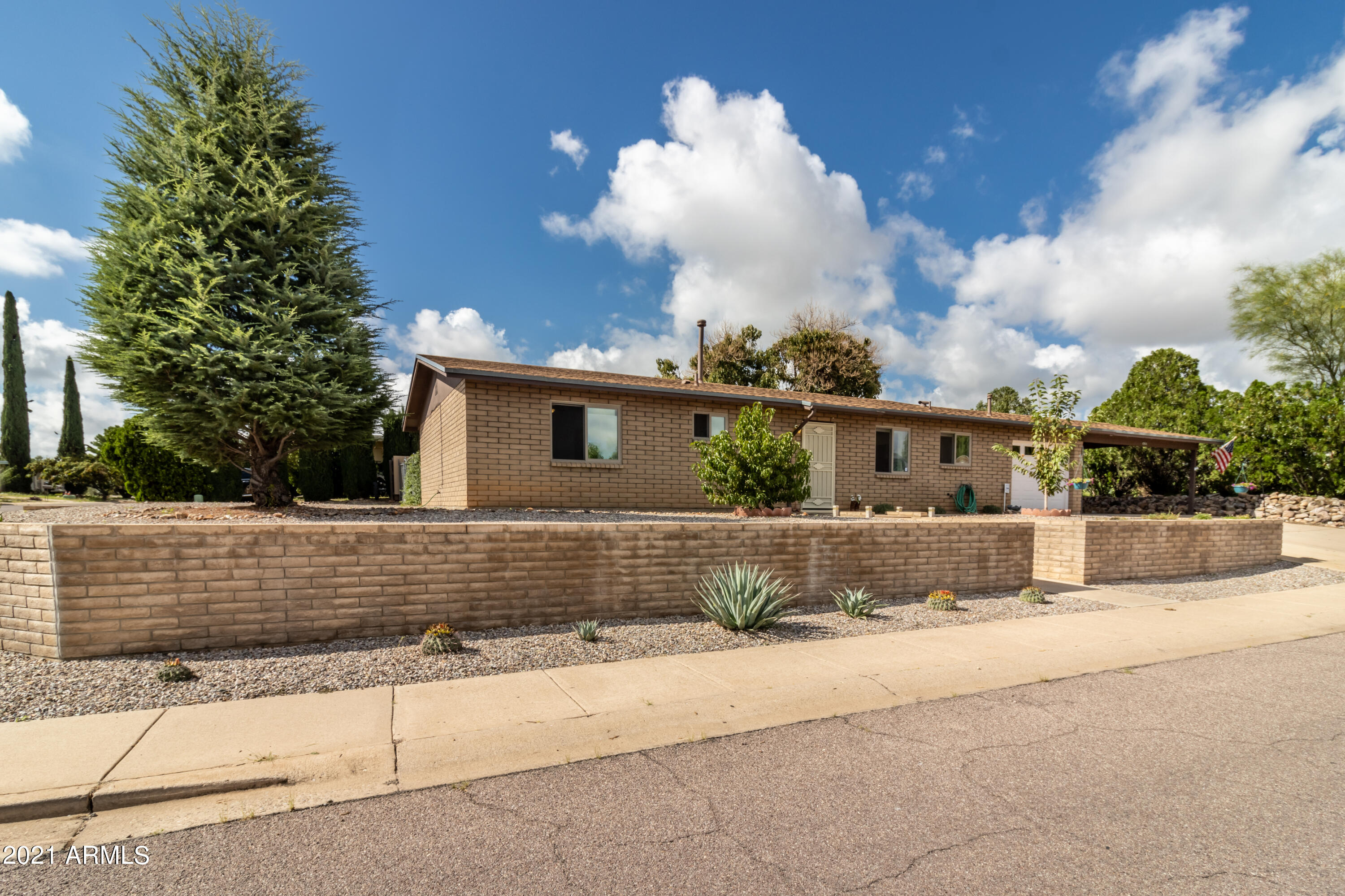 Are you looking for that first home or maybe downsizing? You have to see this home before it gets sold!!! This home is absolutely gorgeous and is move in ready. This home is in a desirable neighborhood close to every amenity Sierra Vista has to offer. It's a spacious 3 bedroom 2 bathroom 1342 square foot home constructed of brick. With a screened in patio with it's own pergola. One car enclosed garage and a two car  carport. This home has been taken great care of with many updates such as new ceiling fans, new front security door, partial kitchen update, new wall sconces, newer hot water heater, newer AC unit, newer furnace, cherry tree with three kinds of cherries, peach tree, fuji and gala apple tree, grapes, pineapple, newer windows, new carpet in master bedroom, new gutters in back new French drain around carport, new landscape front and backyard, rain catch system for apple trees, newer patio and pergola, new underground irrigation pipes for raised garden bed, newer screened in room and new door. Please contact me at 520-249-9187 to see this home for yourself before it's off the market.