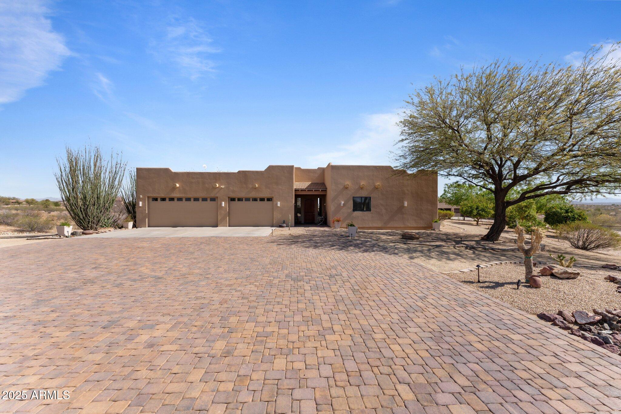 Discover this stunning custom home set on over a 4-acre lot with wrought , complete with a heated negative edge pool and spa. Ideally located near town on paved roads, this 3-bedroom, 3-bath residence combines a contemporary design with a warm, inviting atmosphere. The expansive great room seamlessly connects to the dining area and kitchen, creating a perfect space for entertaining.The enormous master suite features a luxurious master closet with a custom dressing island, while the other two bedrooms each boast stylish en-suite bathrooms. The laundry room impresses with its mudroom entrance and ample storage options. Step outside to a flagstone outdoor living area that leads to the pool and a private orchard filled with a variety of fruit trees. Additional amenities include separate he/sh shed and a porch offering breathtaking mountain views. The property has the potential for an equestrian area with an arena and includes a back road for easy access, accommodating larger trailers or RVs with ease. Don't miss this opportunity to own a slice of paradise!
