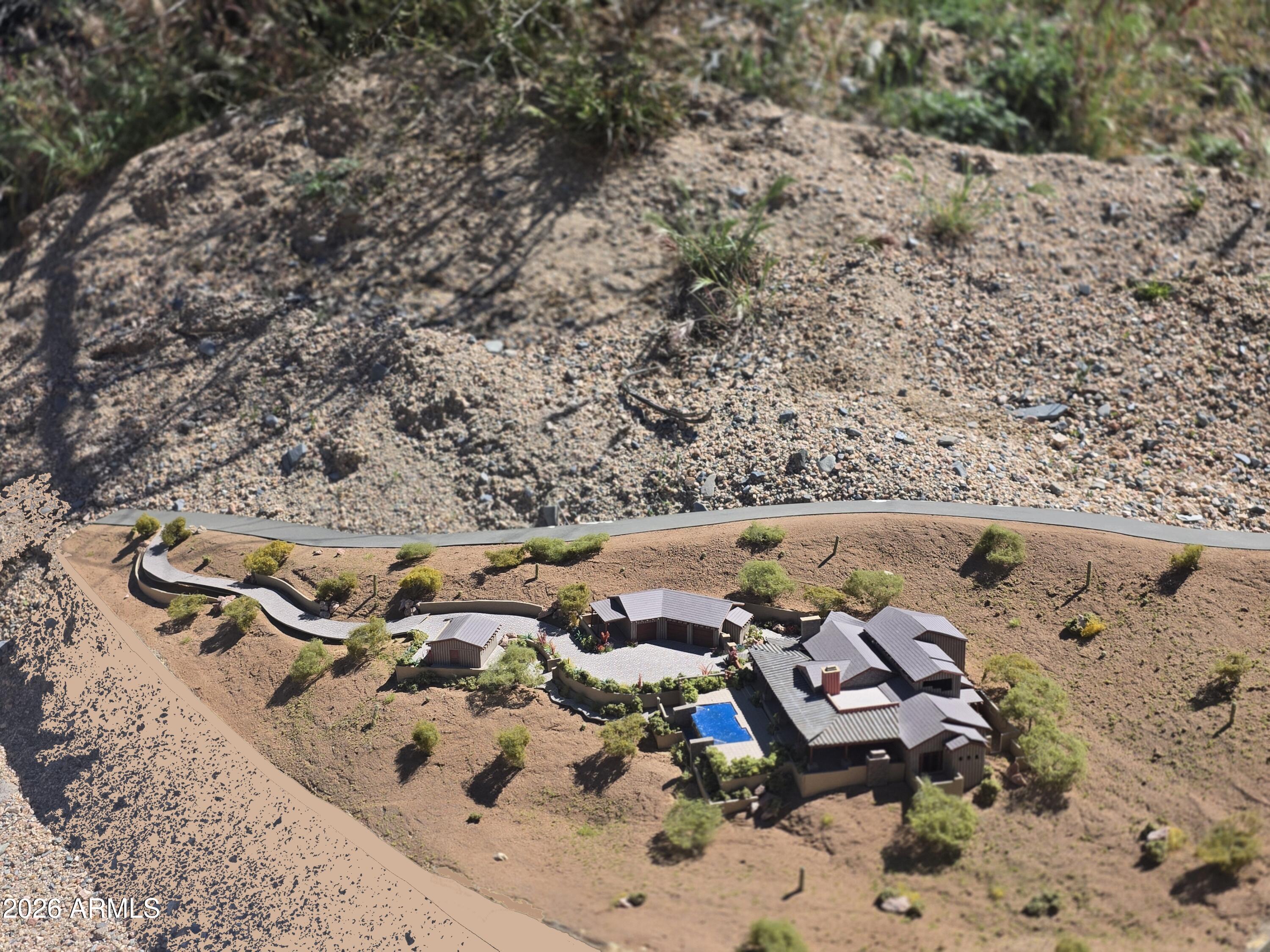 Buildable hillside lot with excellent production private well and PHENOMINAL VIEWS. Gently sloping build envelope will accommodate up to 40,000 + sf home site. PLENTY OF ROOM for a casita and RV garage! NO HOA!.5.17 acre parcel offers a winding drive to private and panoramic views. Have the freedom to build the home of your dreams.  Unobstructed views of True Sonoran living.  5 minutes to Historic Cave Creek (abundant dining and shopping).  20 minutes to the 101/Scottsdale Road.  5726 SF Plan with detached garage will convey with property.