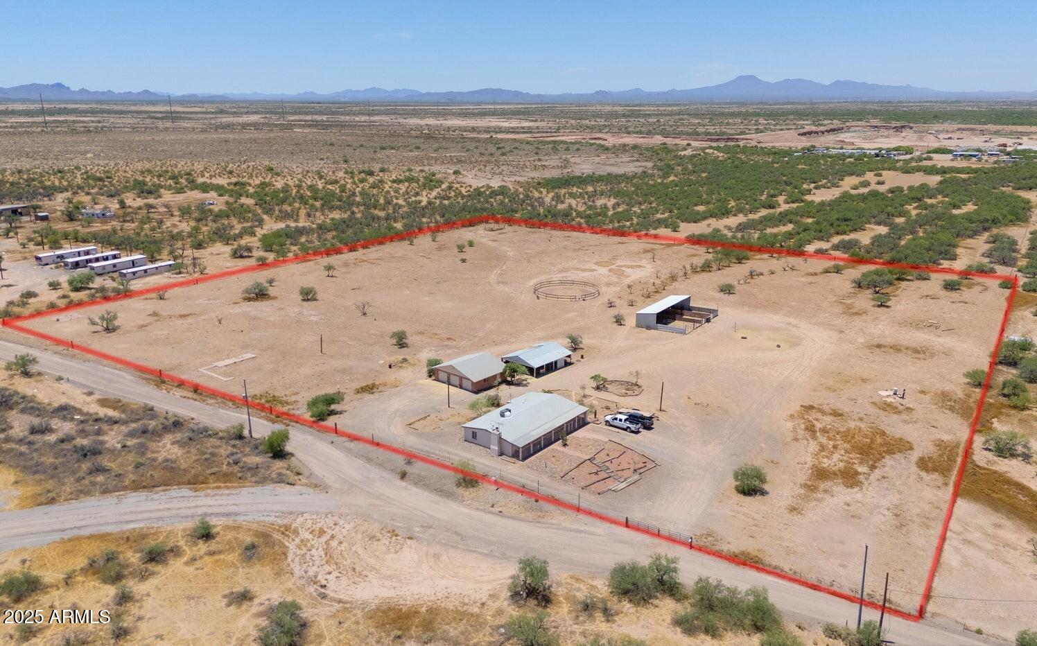 Don't miss this rare opportunity to own a fully fenced 10.037-acre horse property with two private registered wells, just minutes from town offering both convenience and total privacy with beautiful mountain views.
The property includes a detached 3-car block garage with workspace, barn, chicken coop, round pen, and four horse stalls perfect for equestrian use. Nearby trail access adds even more appeal. The sturdy 2 bed, 2 bath block home offers comfortable living, featuring a living/dining area with fireplace and a spacious great room. Both bedrooms are generously sized with ample storage. 
Whether you're looking to board horses, start a business, provide employee housing, or simply enjoy the space this property offers incredible flexibility and opportunity. Send in your offers! This is more than a property; it's your next big adventure waiting to unfold!