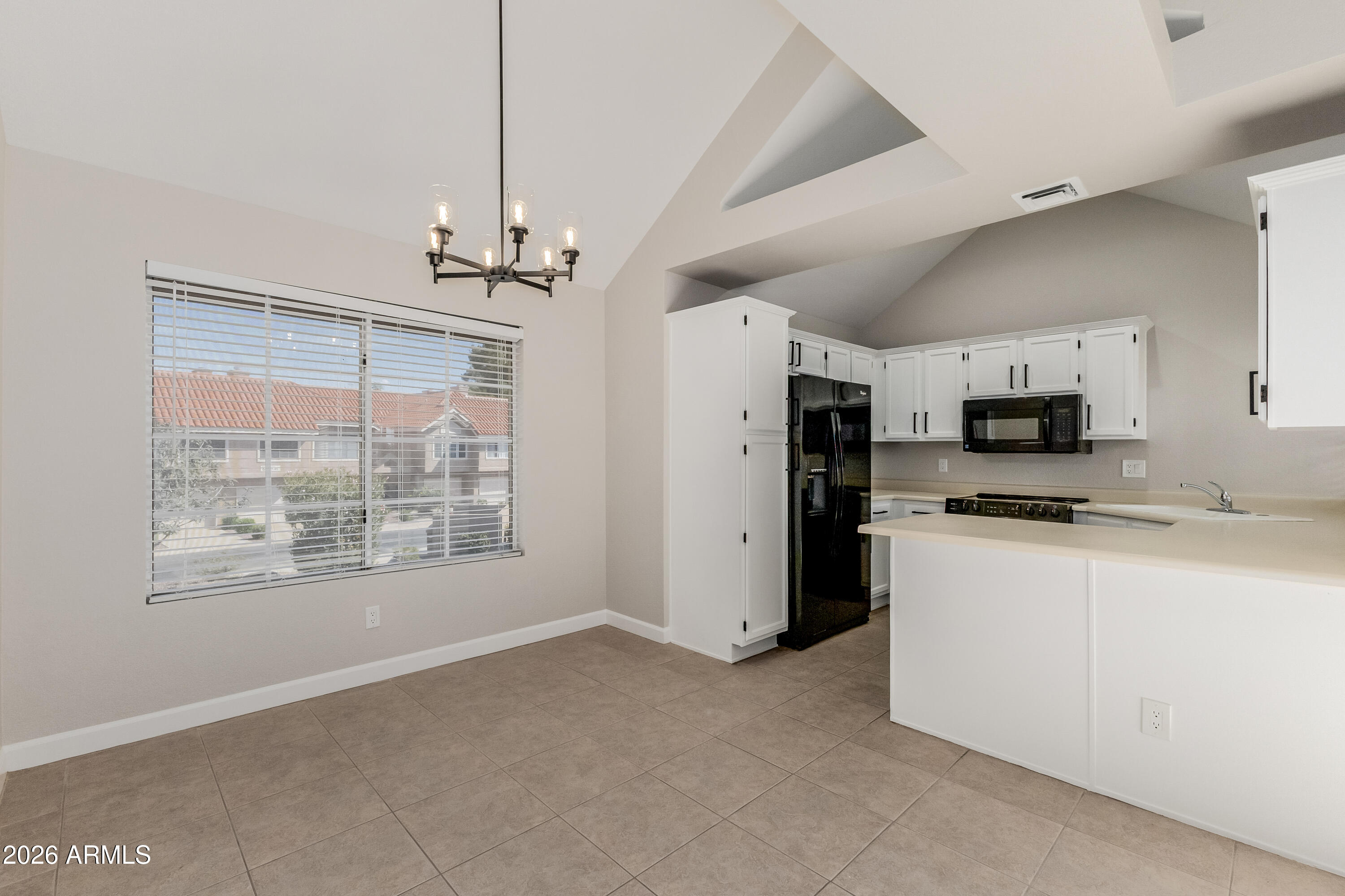 Welcome to the highly sought-after Val Vista Lakes Beach Club community! This immaculate, move-in-ready 2-bedroom, 2-bath home features a desirable open floor plan with vaulted ceilings & abundant natural light. Updates include fresh interior paint, new 4.5'' baseboards, tile in all main living areas, new carpet in the bedrooms, and stylish lighting throughout. The updated kitchen offers refreshed cabinetry with crown molding and hardware. Both bathrooms have been beautifully updated with new vanities, mirrors, lighting, and fixtures. The primary suite features dual closets and a private ensuite. Laundry pantry. Enjoy a generously sized front patio and large deck--perfect for relaxing or watching the sunset. Attached one-car garage. Prime location near freeways, dining, and entertainment. Community amenities include a pool, fitness center, and more. A must-see!