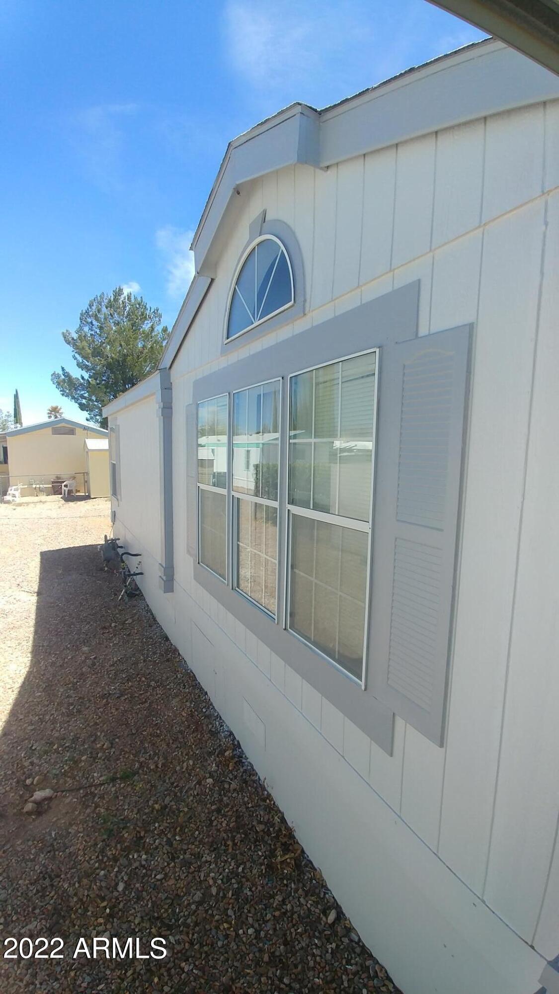 Comfortable, well insulated Fleetwood, Split plan 3 bedroom, 2 bath home. Covered patios front and rear. Covered carport. Gated community with two club houses, 2 pools (one indoor) spa,