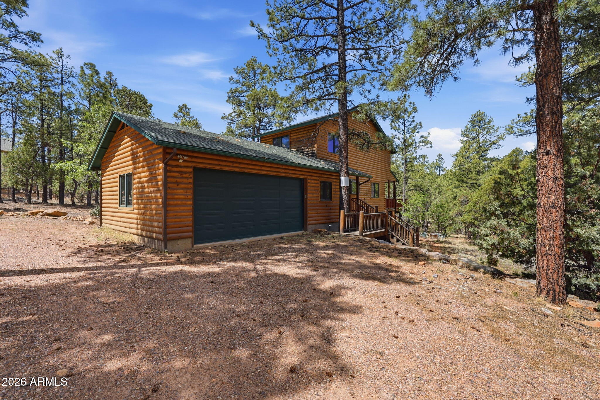 Tucked into a quiet cul-de-sac in High Country Pines, this fully furnished, turnkey, move-in-ready home offers space, privacy, and a true mountain setting on nearly an acre backing to the greenbelt. This 5-bedroom, 3.5-bath layout features updated Coretec LVP flooring and new paint throughout, a refreshed kitchen with granite counters and stainless steel appliances, fully remodeled bathrooms, and a comfortable great room with a wood-burning stove. The main-level primary suite includes an electric fireplace, a full bathroom, and direct access to the large deck. Upstairs offers two bedrooms, a full bath, and a loft overlooking the living area. The finished walkout basement adds a large primary space, two more bedrooms (one with built-in bunk beds), a full bath, and a dedicated theater room.
