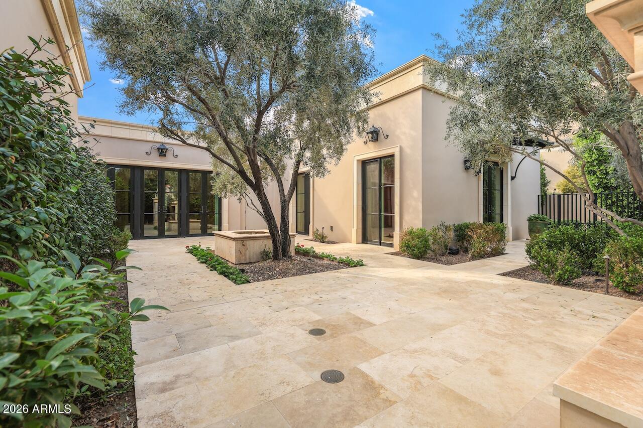 European-inspired home with stunning views of Camelback Mountain, completely rebuilt to the studs in 2019 with exceptional craftsmanship and high-end finishes. Designed by Schultz Development with interiors by DeCesare Design Group.
This 3-bedroom residence features en-suite baths in every bedroom. The gourmet kitchen includes La Cornue cookware, Sub-Zero refrigerator and freezer, and granite slab countertops. Walnut wood flooring and limestone tile run throughout, while bathrooms feature marble slab counters, marble mosaic shower flooring, and ceramic tile finishes. Architectural details include oversized baseboards, crown molding, and distinctive ceiling treatments throughout the home.
European-inspired gardens wrap around the property, creating exceptional outdoor living spaces. Residents also enjoy access to JW Marriott Scottsdale Camelback Inn Resort & Spa amenities at a resident discount, including dining, spa, and fitness facilities. Turnkey and ideal for both year-round living or a seasonal Arizona retreat.