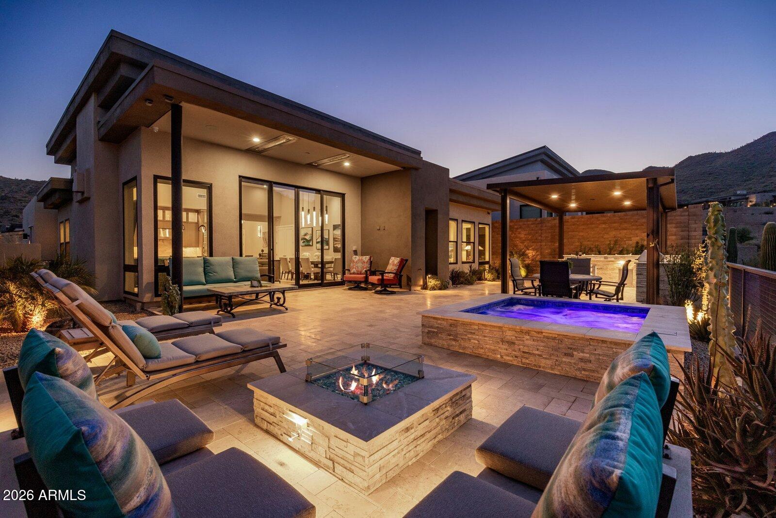 Experience refined desert luxury in this spectacular, extensively upgraded Toll Brothers residence in coveted Adero Canyon, where breathtaking canyon views, resort-inspired outdoor living, and timeless craftsmanship define every space. Showcasing over $739,000 in premium builder upgrades and custom after-market enhancements, this thoughtfully designed split floorplan offers two private ensuite bedrooms plus a private executive office, providing the ideal balance of comfort, privacy, and flexibility. Chef's kitchen features Wolf appliances, 48'' Sub-Zero refrigerator, Taj Mahal quartzite waterfall island and countertops, ceiling-height full-overlay maple cabinetry, and a True dual-zone wine refrigerator. Elegant wide-plank hardwood flooring, a dramatic linear fireplace, 14.5 ft ceilings, solid-core doors, white interior framed Anderson windows, automated Lutron shades and lighting, ELAN whole-home automation, designer lighting, and integrated audio. The climate-controlled epoxy garage includes EV charging prewire. Outdoors, relax on the expansive covered patio with heated spa, custom lighting and water feature, pergola, built-in BBQ and cooktop, fire feature, outdoor entertainment, and wrought-iron view fencing designed to maximize spectacular canyon vistas. Every detail was thoughtfully selected to create a retreat that seamlessly blends timeless design, modern technology, and effortless Arizona indoor-outdoor living.

Enjoy direct access to Adero Canyon trailheads, proximity to world-class golf and Fountain Hills dining, and the option to join the Adero Resort & Spa for fitness, tennis, pickleball, and resort amenities.

Comprehensive list of luxury features listed in Documents Tab in MLS.