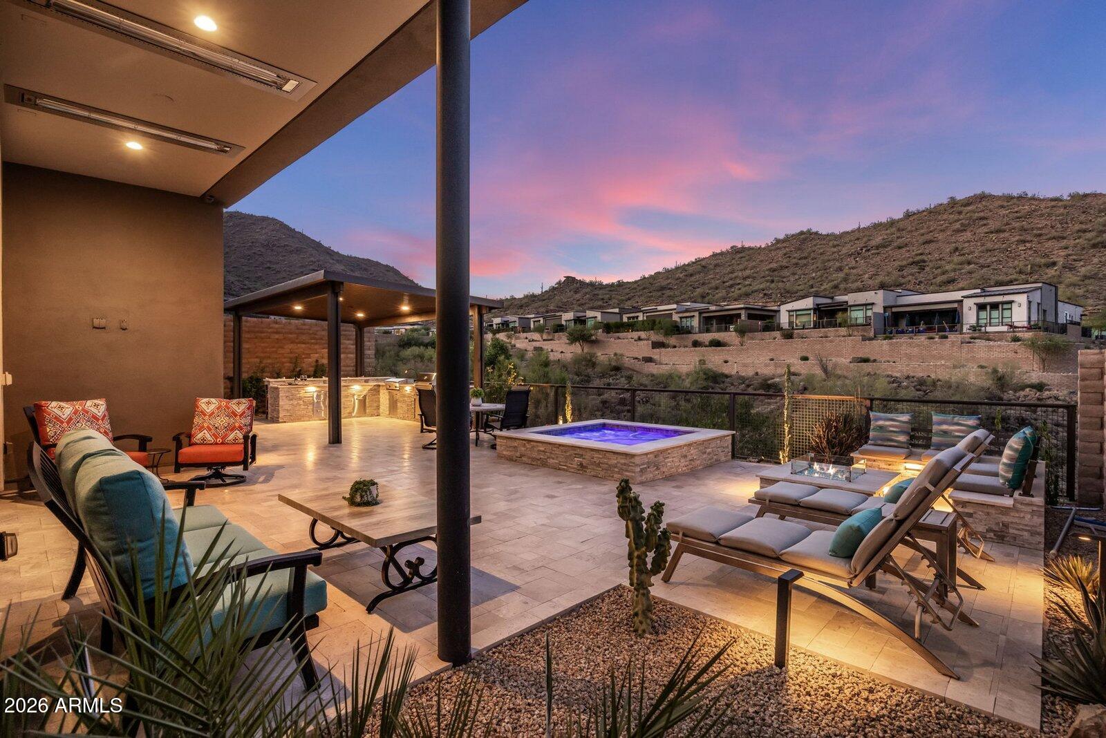 Experience refined desert luxury in this spectacular, extensively upgraded Toll Brothers residence in coveted Adero Canyon, where breathtaking canyon views, resort-inspired outdoor living, and timeless craftsmanship define every space. Showcasing over $739,000 in premium builder upgrades and custom after-market enhancements, this thoughtfully designed split floorplan offers two private ensuite bedrooms plus a private executive office, providing the ideal balance of comfort, privacy, and flexibility. Chef's kitchen features Wolf appliances, 48'' Sub-Zero refrigerator, Taj Mahal quartzite waterfall island and countertops, ceiling-height full-overlay maple cabinetry, and a True dual-zone wine refrigerator. Elegant wide-plank hardwood flooring, a dramatic linear fireplace, 14.5 ft ceilings, solid-core doors, white interior framed Anderson windows, automated Lutron shades and lighting, ELAN whole-home automation, designer lighting, and integrated audio. The climate-controlled epoxy garage includes EV charging prewire. Outdoors, relax on the expansive covered patio with heated spa, custom lighting and water feature, pergola, built-in BBQ and cooktop, fire feature, outdoor entertainment, and wrought-iron view fencing designed to maximize spectacular canyon vistas. Every detail was thoughtfully selected to create a retreat that seamlessly blends timeless design, modern technology, and effortless Arizona indoor-outdoor living.

Enjoy direct access to Adero Canyon trailheads, proximity to world-class golf and Fountain Hills dining, and the option to join the Adero Resort & Spa for fitness, tennis, pickleball, and resort amenities.

Comprehensive list of luxury features listed in Documents Tab in MLS.