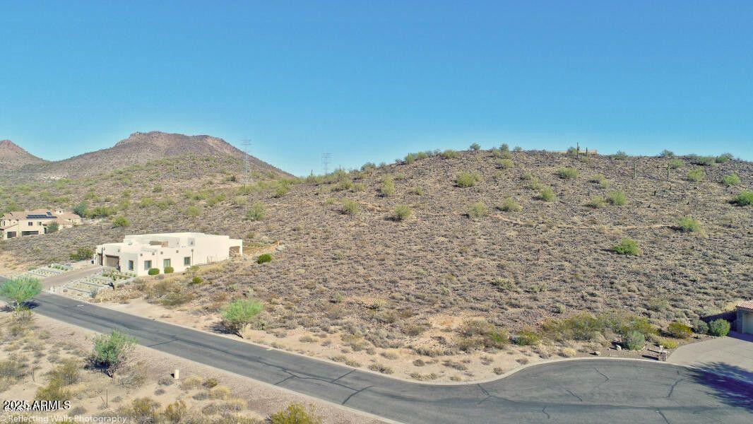 Exquisite lot for your custom home in the exclusive community of Tuscany Hills! This masterpiece property is nestled along the foothills of Thunderbird Mountain and offers absolute privacy with almost an acre of land that backs up to city mountain preserves. Don't let this rare opportunity pass you by. Build your dream home now!