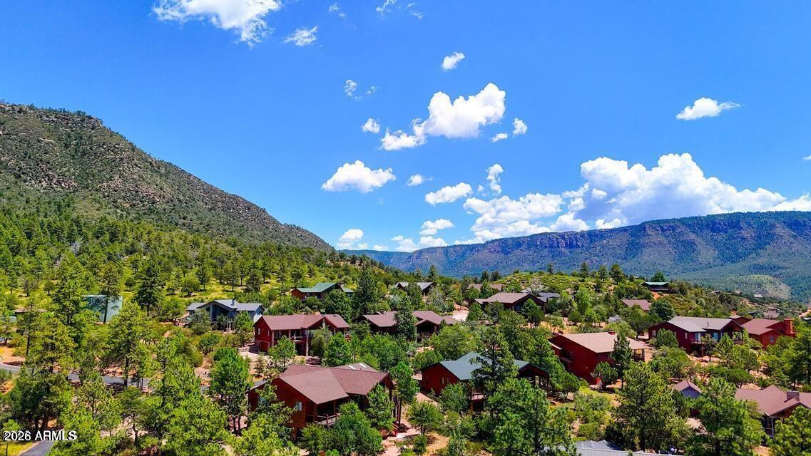Nestled in a private gated community in Pine, this beautiful parcel offers a serene, wooded setting with mature pine trees and scenic views. Surrounded by custom cabin homes, it provides both privacy and a welcoming mountain community. Utilities are available at the lot, making it ready for your dream retreat. Just minutes from Pine's shops and restaurants. SELLER FINANCING AVAILABLE