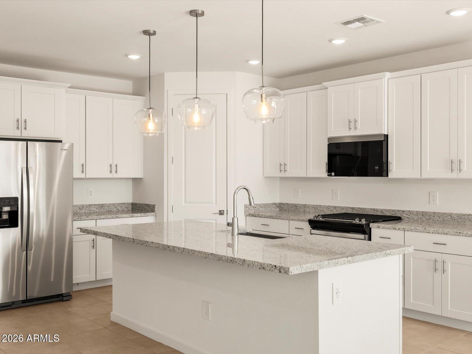 Charming Sawyer floor plan in the desirable Entrada community in Tolleson. This single-story home features a split floor plan with a comfortable primary suite set apart from the secondary bedrooms. The secondary generously sized bedrooms and a functional layout make this home ideal for a variety of living needs. Upgrades include white cabinetry with hardware, granite countertops, and extensive tile flooring that complement the home's modern design. Meritage homes are move-in ready with washer, dryer, refrigerator, and window blinds included, plus closing in 60 days or less guaranteed. Future community amenities will include a clubhouse and pool, perfect for easy living and entertaining. Each of our homes is energy-efficient construction while providing comfort and long-term savings.