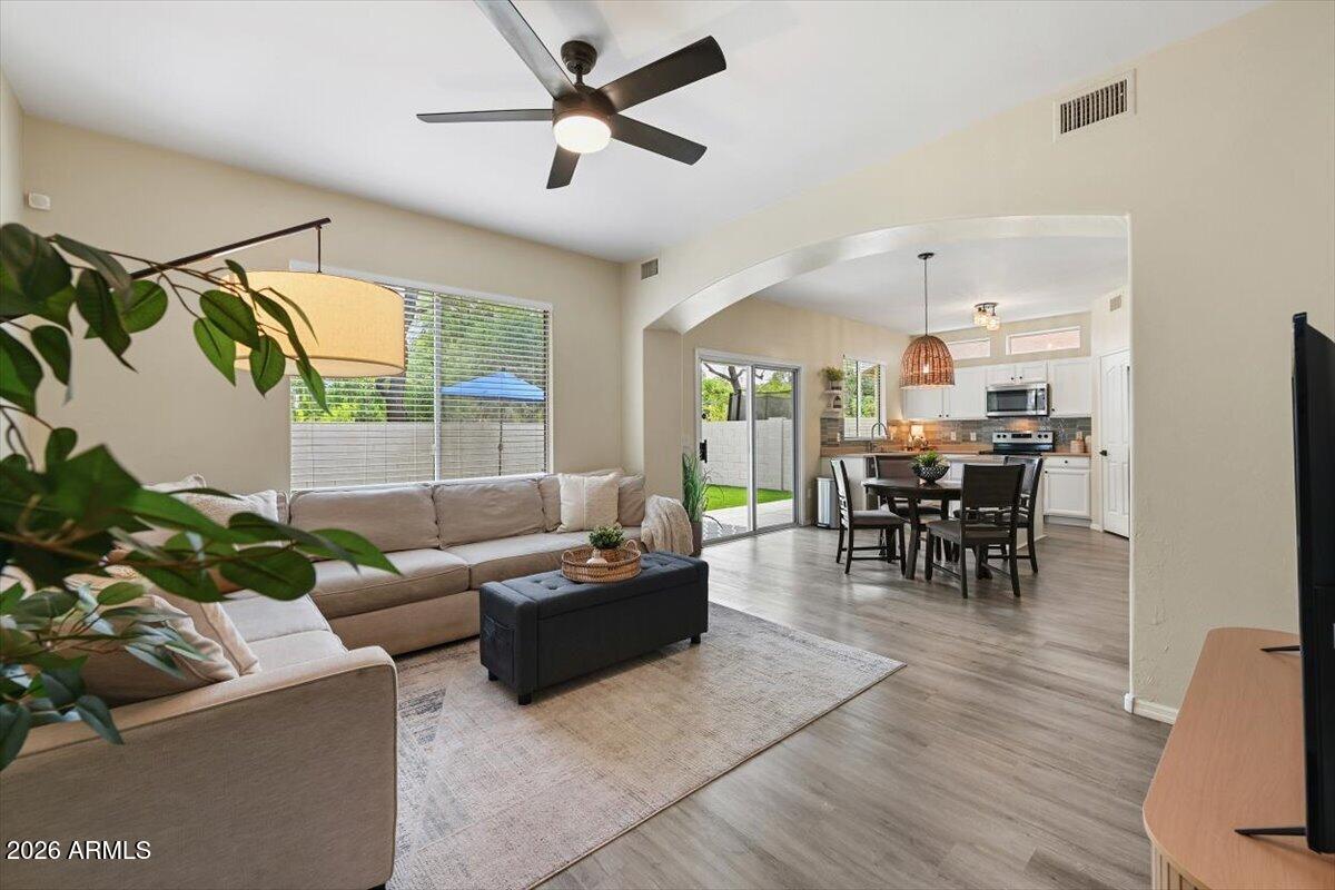 Gilbert gem! One of those special properties situated with unobstructed views of lush tree lined park and adjacent to grassy common area so only one neighbor next door. This handsomely updated move-in ready 4-bedroom, 2.5 bath offers seamless flow between family, kitchen and dining all with views to the backyard. Upstairs laundry room convenient to all bedrooms. Recent upgrades: new windows (2026), new A/C unit (2023), new water heater (2024), new washer/dryer (2025), new luxury wood like plank flooring and carpet (2022), updated bathrooms and kitchen, new light fixtures throughout, new low-maintenance turf in both the front and backyards, high-end garage door. Kitchen features durable Corian countertops, island, walk-in pantry, stylish tiled backsplash. Wonderful home and neighborhood! Located in the heart of Gilbert in a beautifully appointed neighborhood chocked full of amenities with pool, park/playground, basketball court and volleyball. Near top-rated schools, and shopping. Truly a stand out home not to be missed!
