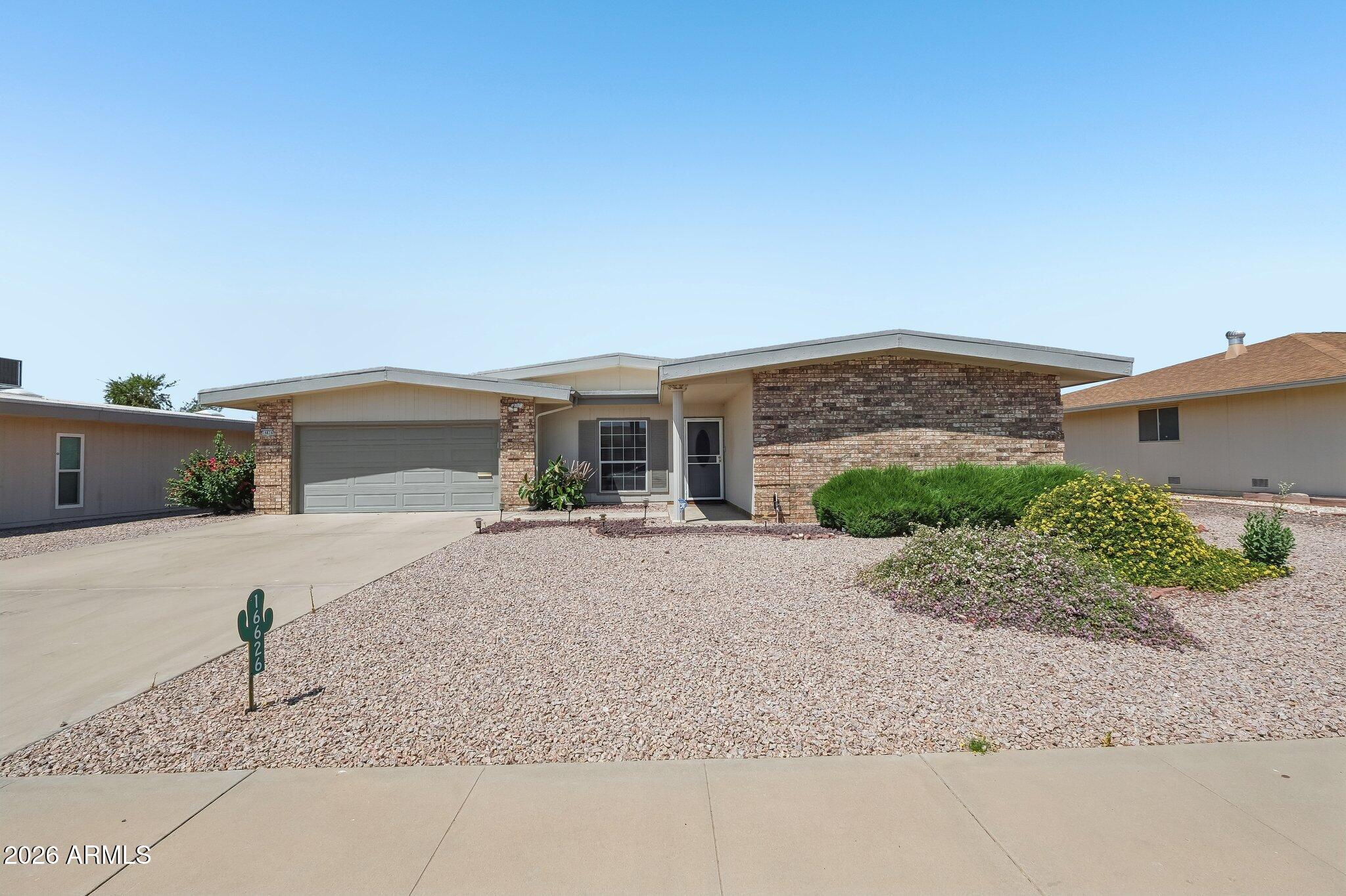 Well-maintained 2-bedroom, 2-bath home offering 1,286 sqft on a 9,175-square-foot lot in Sun City. The open floor plan features a spacious living area, breakfast nook, and a functional kitchen with ample cabinet and counter space. A versatile bonus room provides additional living space and works well as a home office, hobby room, or second living area. The primary suite includes a private ensuite bathroom and ample storage, while the guest bedroom and full bath provide comfortable accommodations for visitors. The screened Arizona room overlooks a low-maintenance fenced backyard. Additional features include an inside laundry room, 2-car garage, and plenty of storage throughout. Conveniently located near Sun City recreation centers, golf courses, shopping, dining, and medical facilities.